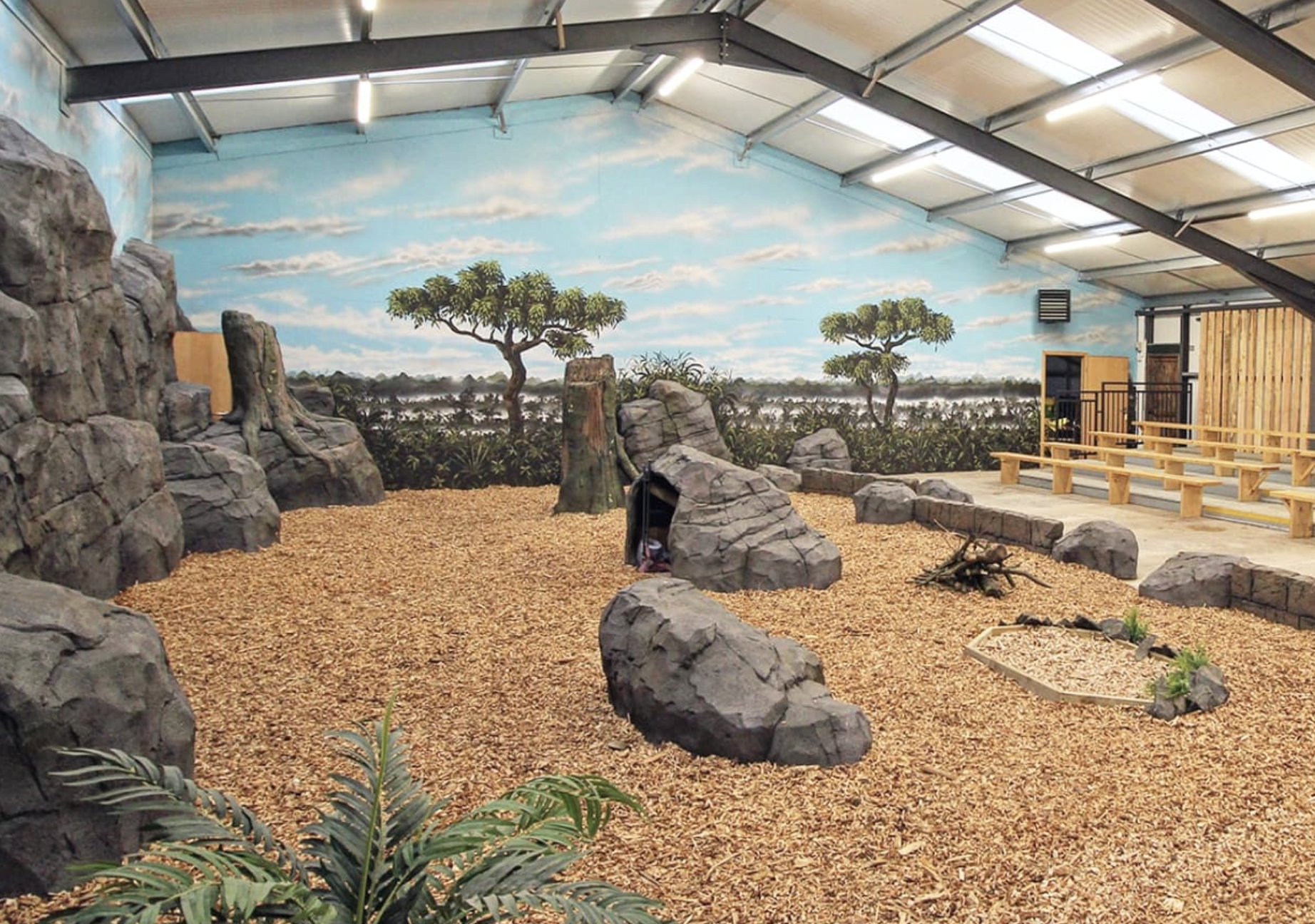 Themed education area for zoo visitors created from artificial rock