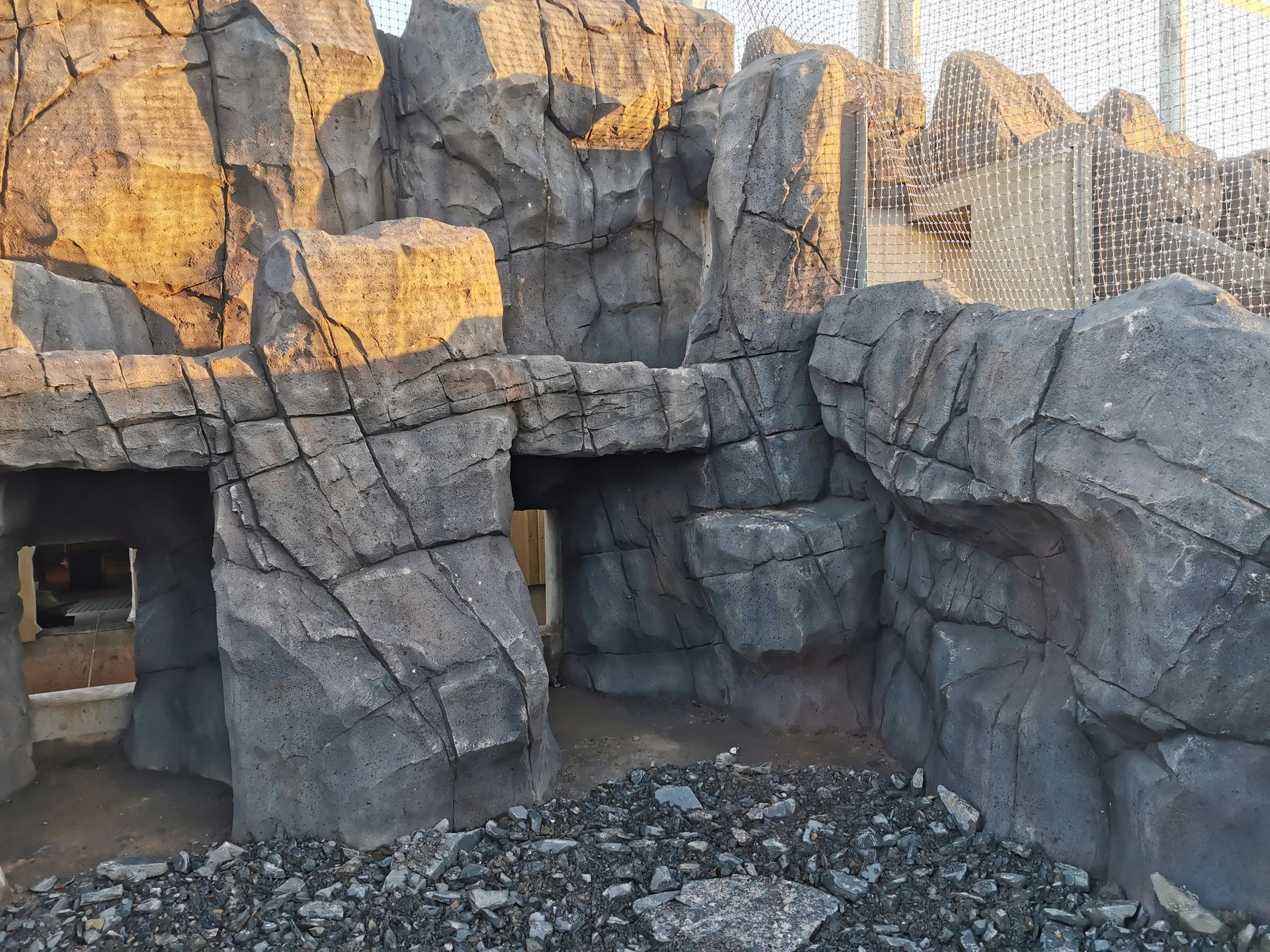 Zoo enclosure made from concrete to look like stone and rock