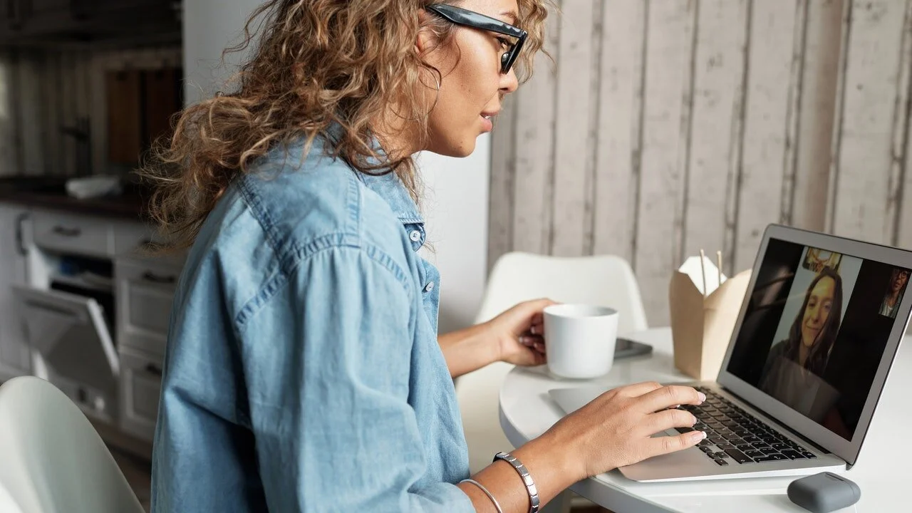 woman-in-blue-denim-jacket-using-macbook-pro.jpg