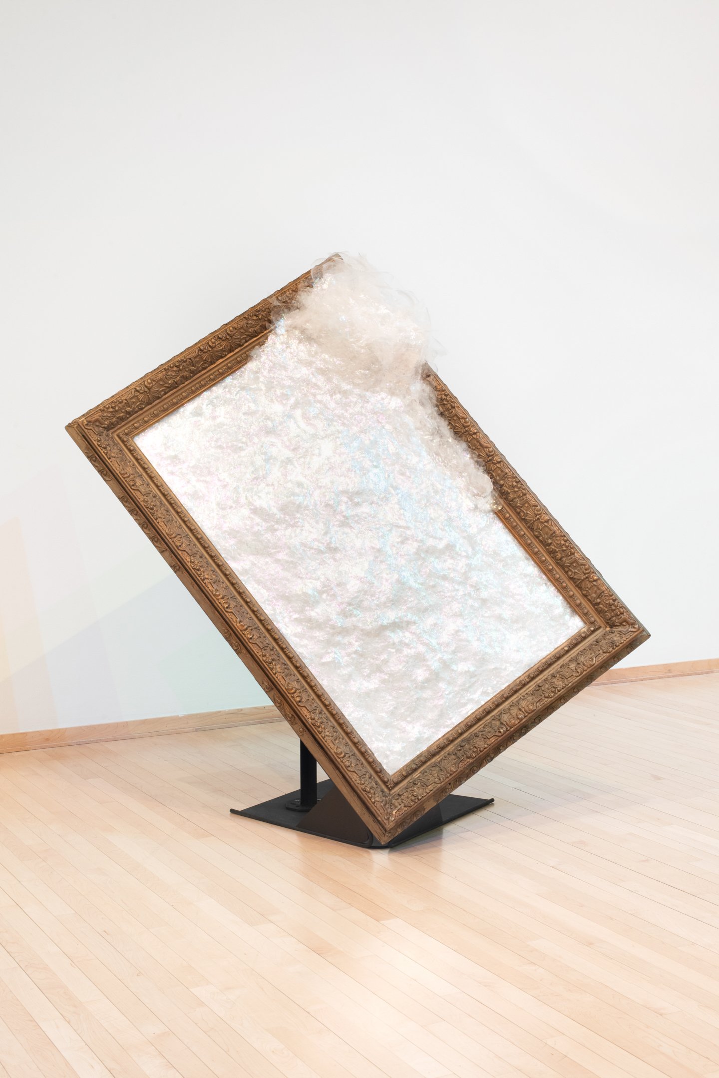 "Evading Mirror," 2025, Glass, Found Frame, Glue, Paint, and Steel. 71”by 41”by 6” Photo Credit: Neighboring Sates