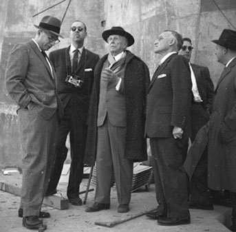 Frank Lloyd Wright (center) with Rabbi Mortimer J. Cohen (right of architect) and member of the Building Committee on the site of Beth Sholom Synagogue, February 1958
