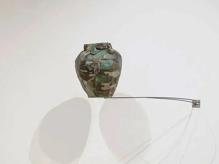 "It Ain’t Hard to Tell,"

Repurposed Army Fatigue, 18”x 16”, Photo Credit: John Carlano