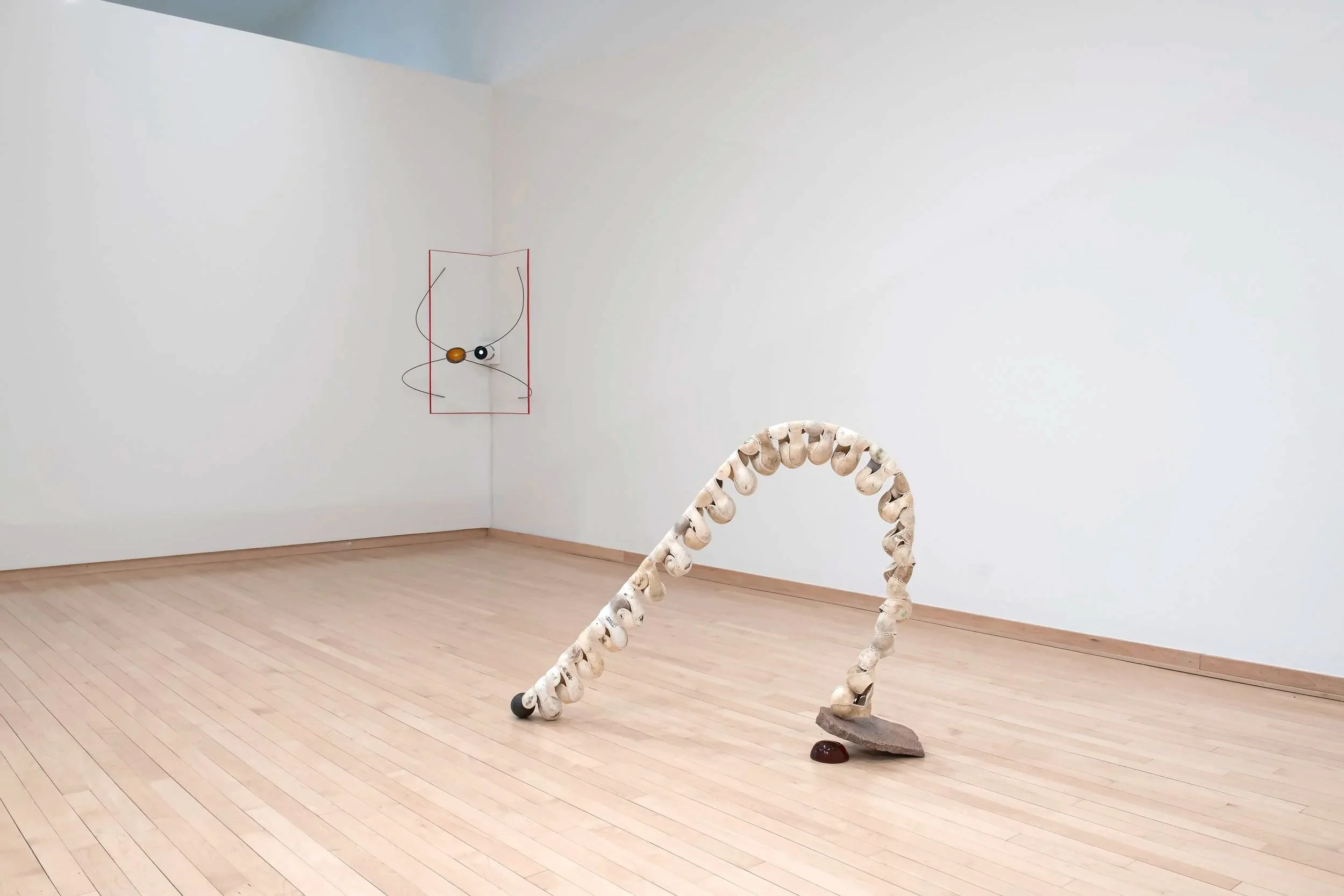 "Spine" 
Installation View.
Leather, silk, granite, steel, ball bearings, pine rosin, Darth Vader house key. ~42”
×10"×36"
"Consider the Grip"
Installation View.
Steel, pine rosin, projector, It Happens Every Spring (1949), Throwing in Baseball via 

