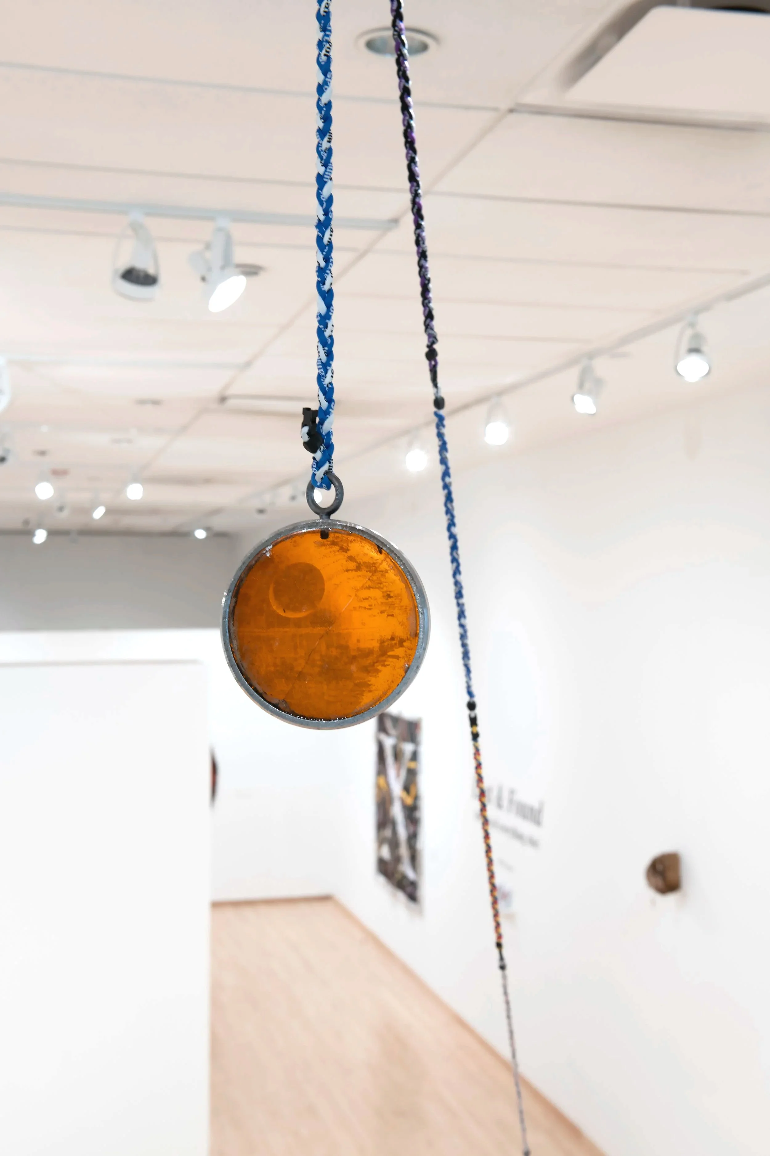 "That’s No Moon" (detail)
Steel, pine rosin, Death Star temporary tattoo, used titanium magnet braided 
necklaces, stone. Dimensions variable. Photo Credit: John Carlano