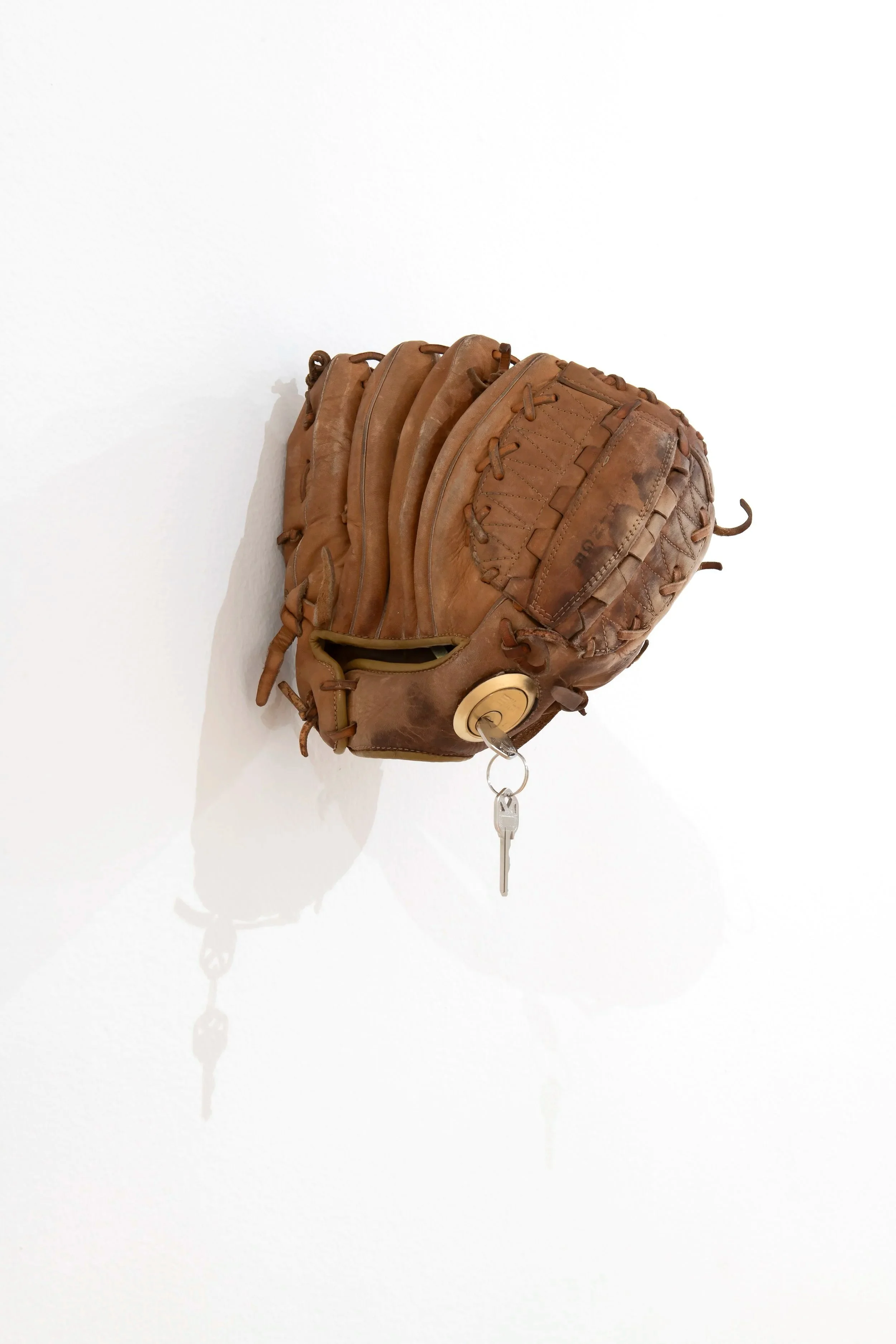 Untitled (Catfish Hunter)
Leather, partial deadbolt lock, pine rosin. ~6”×9”×8" Photo Credit: John Carlano