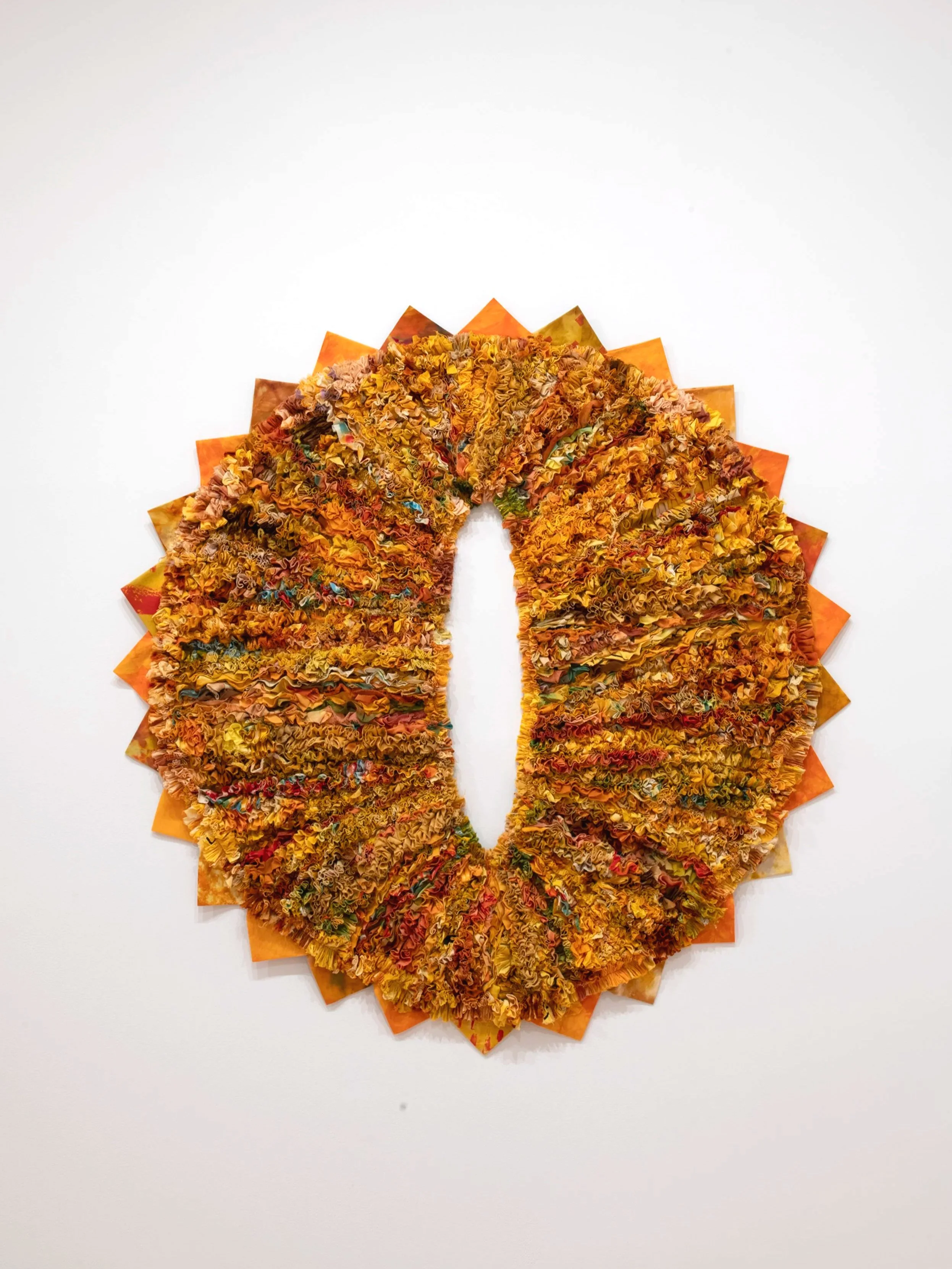 "O-Face"
cotton fabric shreds, scraps, slivers, and rags collected from artist’s practice, donation bins, and trash cans in Tyler; overdyed yellow. 64” x 64”. Photo Credit: John Carlano