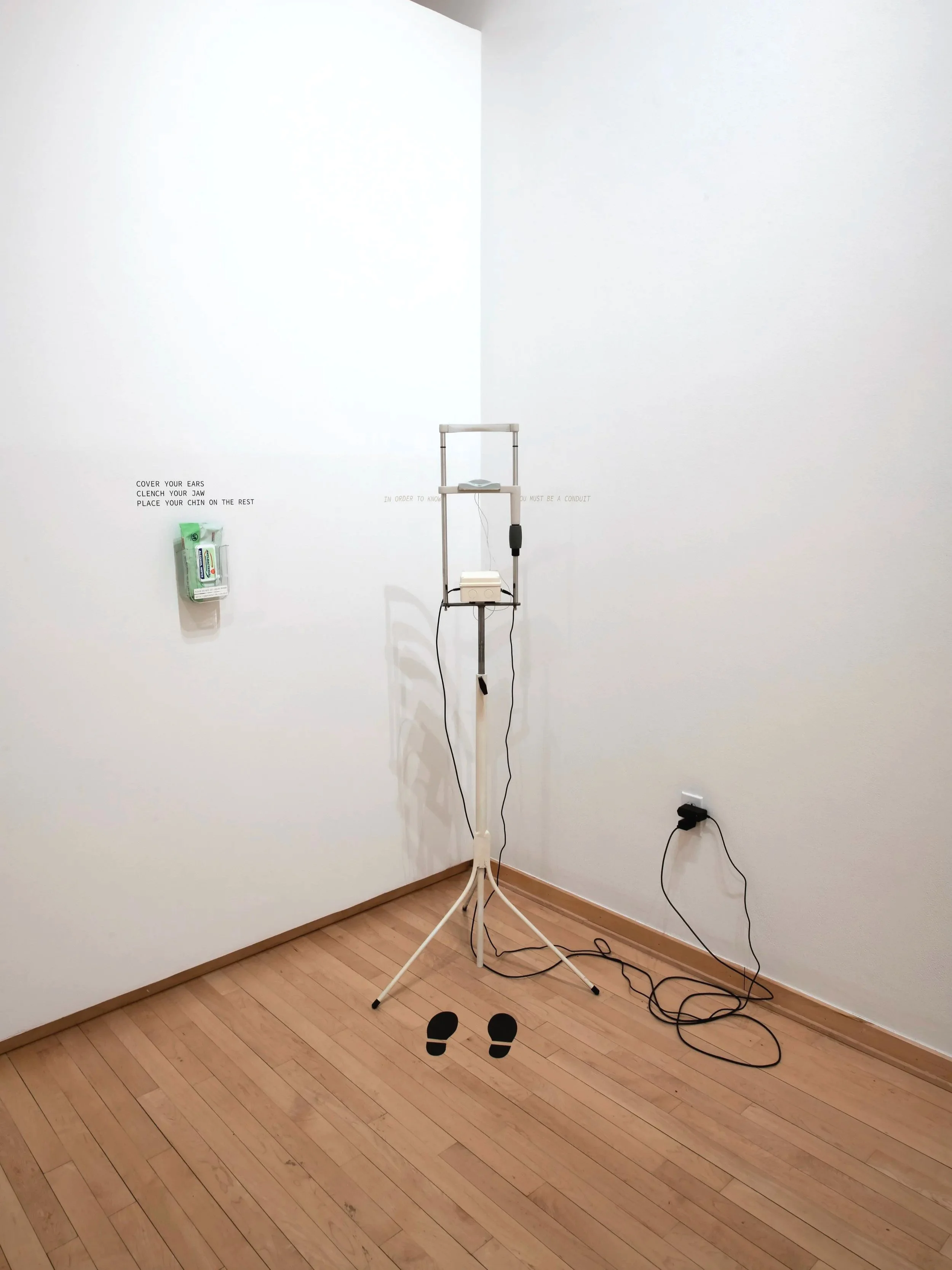 "Sermon"
Materials: Slit Lamp, Bone conduction transducer, mp3 player, ai cloned voice of Kenneth Copeland,
60 Inches” by 12 Inches”.
Photo credit: John Carlano