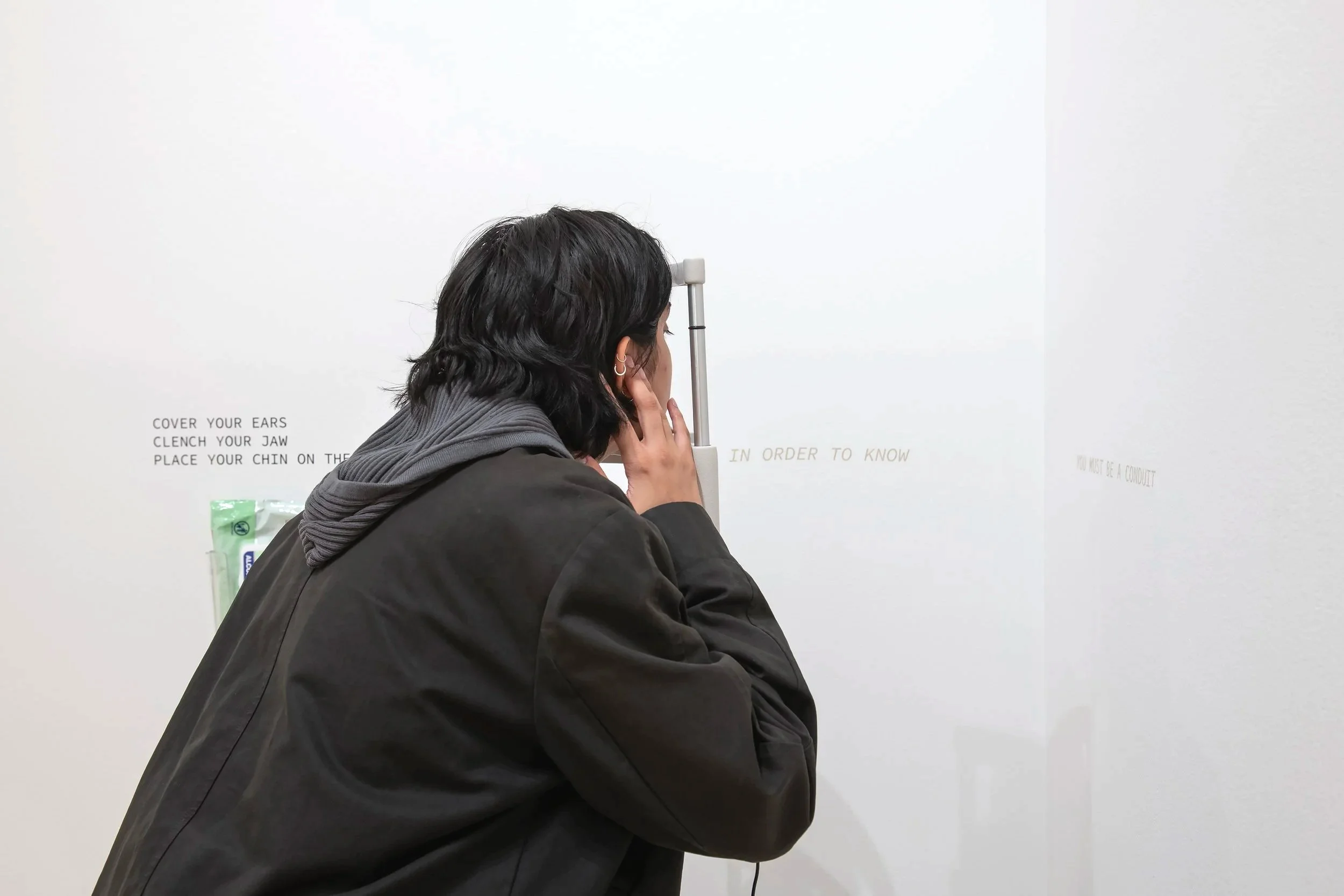 "Sermon"
Materials: Slit Lamp, Bone conduction transducer, mp3 player, ai cloned voice of Kenneth Copeland,
60 Inches” by 12 Inches”.
Photo credit: John Carlano