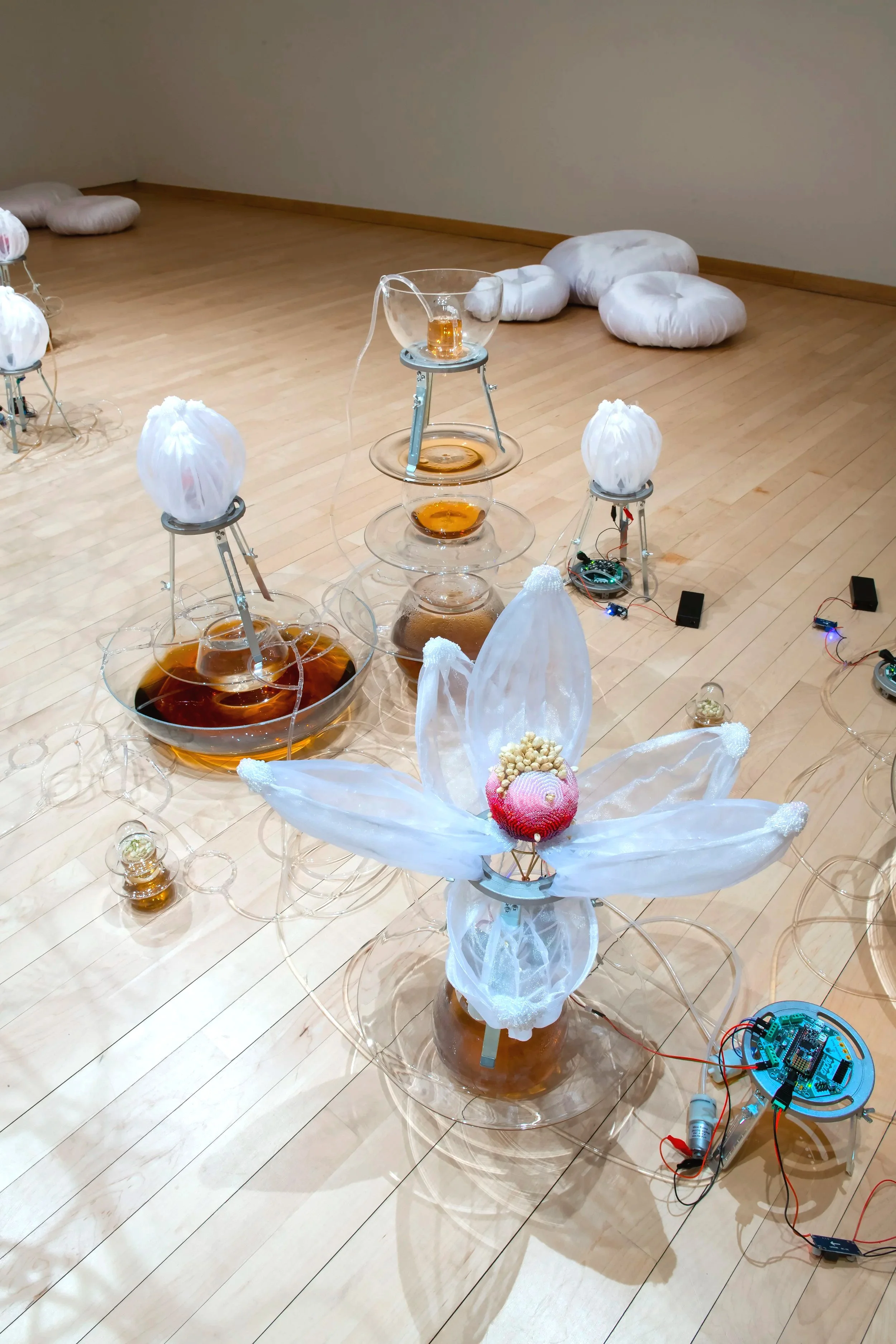 "Jasmine Automata" (detail)
Installation, Materials: Dried jasmine flowers, jasmine tea, blown glass, glass seed 
beads, organza, brass, aluminum, silicone, acrylic, PLA, PVC tubing, microcontrollers, 
electrical wires, servo motors, air pumps, peris