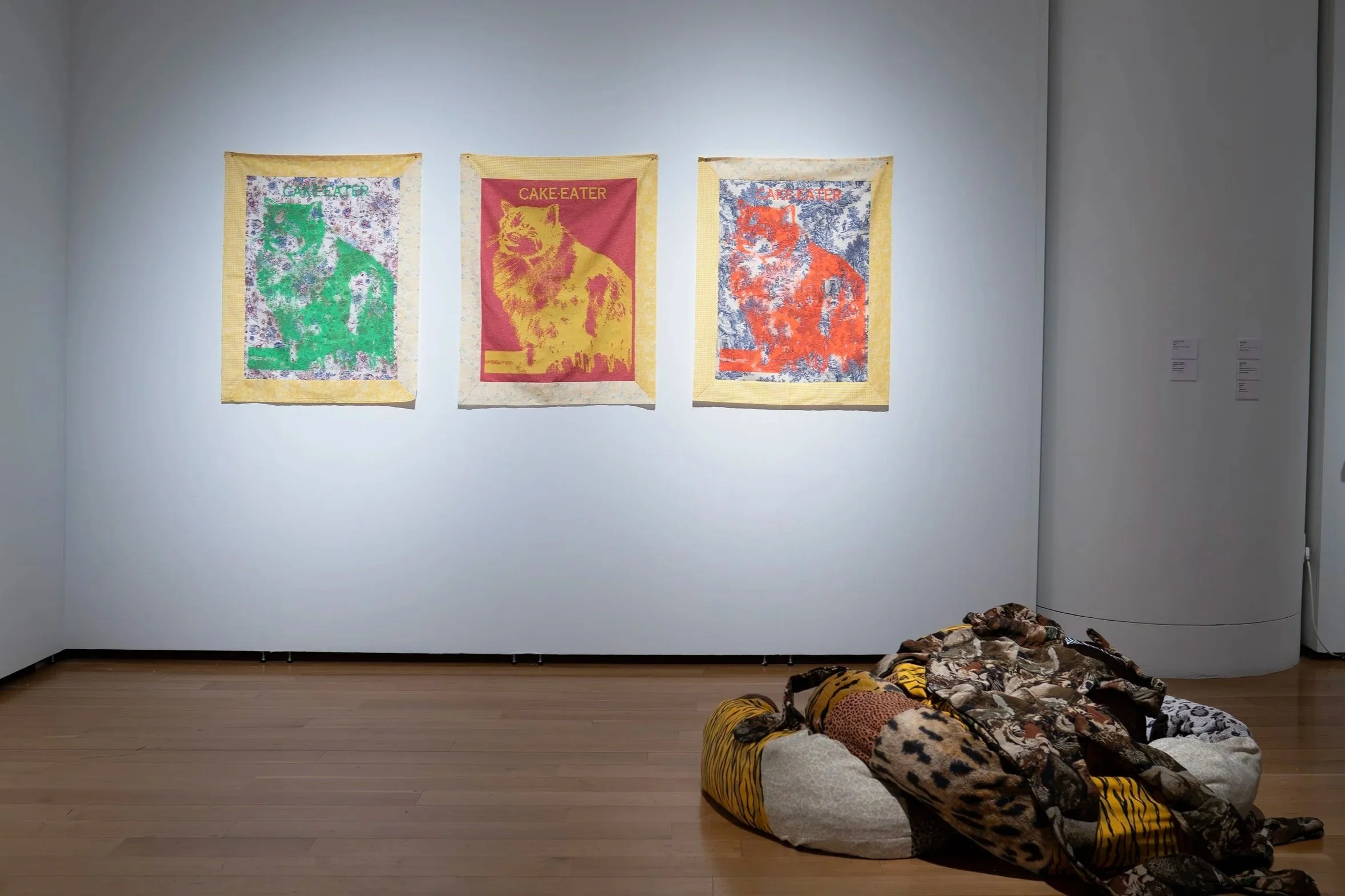 Joseph E. Malson, 
Cake Eaters, 
2026, 
Found fabric, acrylic ink, thread. 
32" x 24"
and
Joseph E. Malson, 
One Blue Pussy (Shadow), 
2026, 
Found material, thread. 
Dimensions variable 