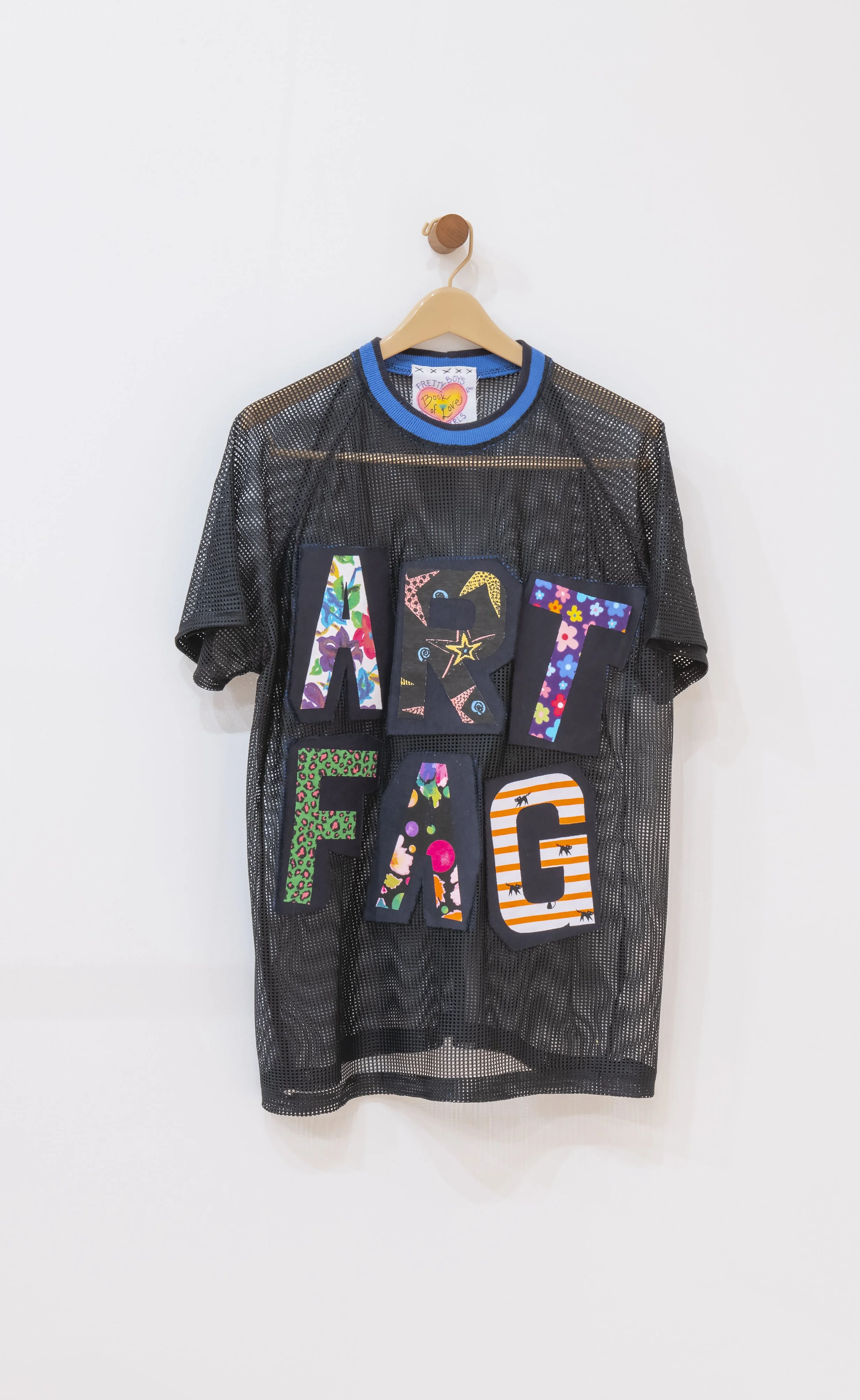 "Teenage Suicide 2"

Found Material, Thread, Adhesive, Garment Hanger, Wood 

34”x17x3” Photo Credit: John Carlano