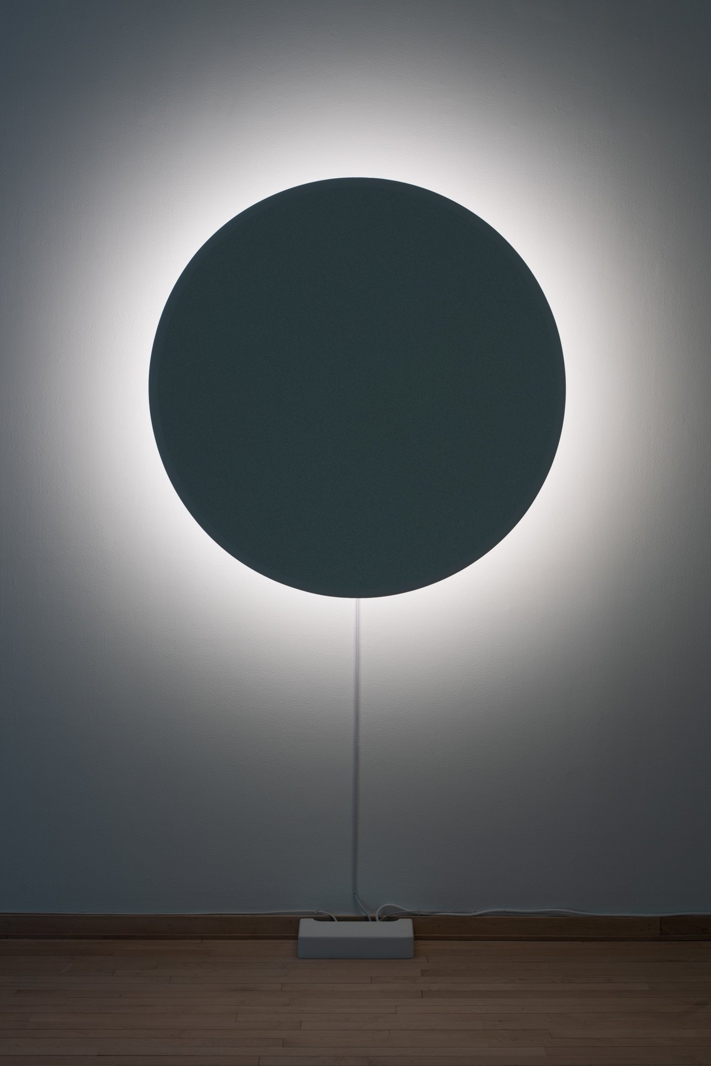 "In Totality" (still), 2025,
Time-based installation view showing “Optic Disc (Red)”
Retroreflective glass microspheres, acrylic paint, foam, steel, LED light, computer controller. 46” by 46” by 14”
Photo credit: Neighboring States