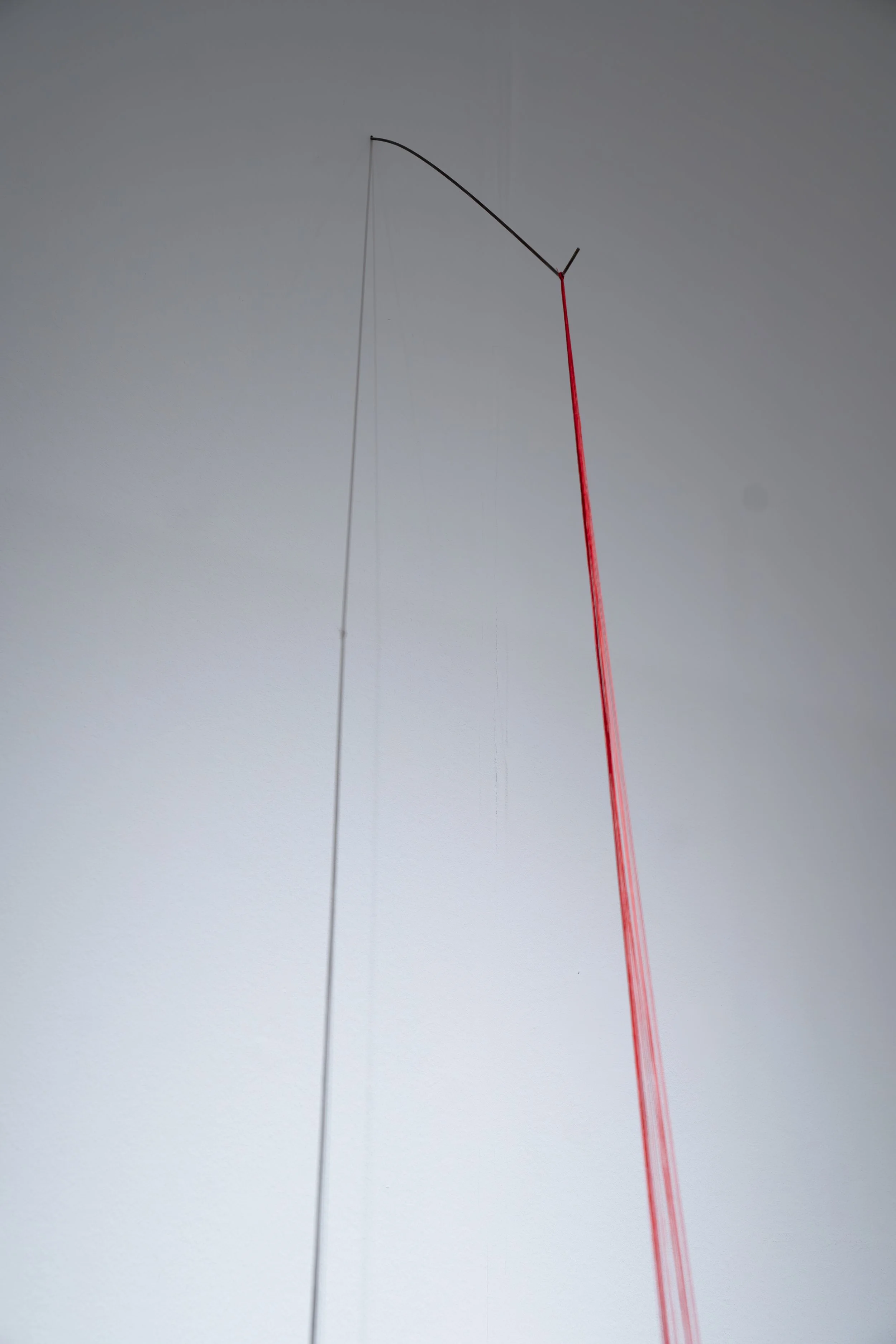 Mary Champagne,
Sunk cost, 
2025, 
Nylon, marble, steel. 
7" x 102" x 30"
