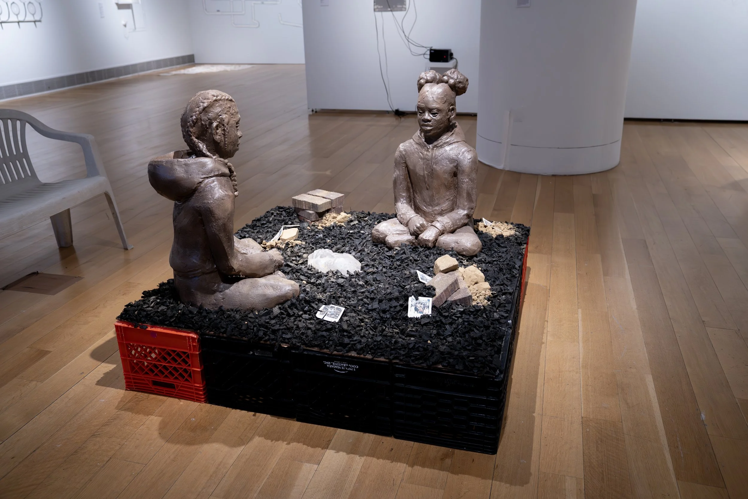 Marcè Nixon-Washington, 
Those abandoned lots for sale... 
2026, 
Stoneware, porcelain, locally dug clay (Temple  
University Campus), mudcloth fabric (cotton,  
black tea, and locally dug clay), kiln-cast glass,  
bricks. Image reference: Heinz Hist