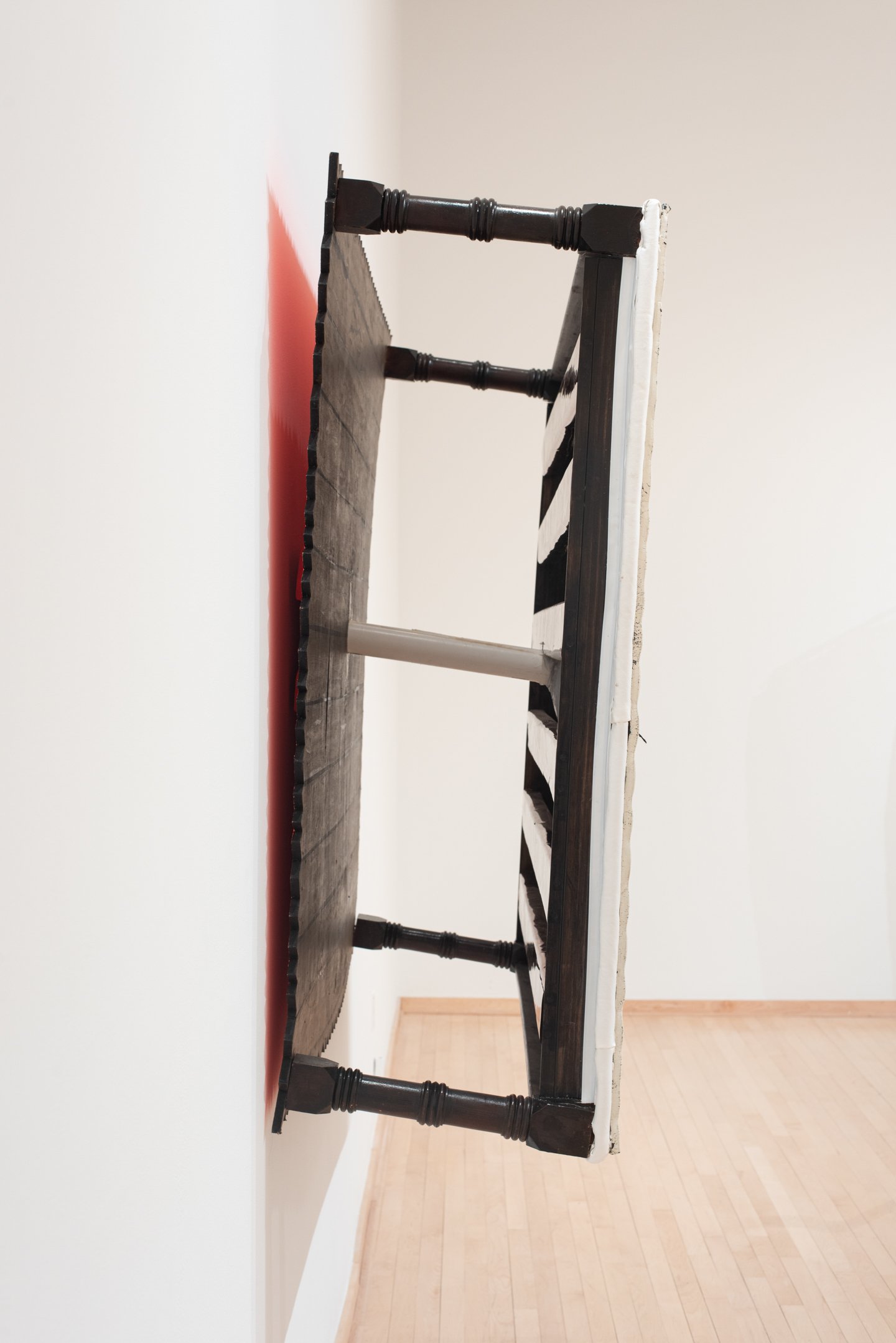 "Mattress Painting #1" 2025, 62"x55.5"x20.2", foam pad, mdf, wooden rails, paint, soy wax, The first in a new series of sculptural paintings that examine the mattress as a portrait. The foam is the canvas and our bodies the brushes and paint. What ma