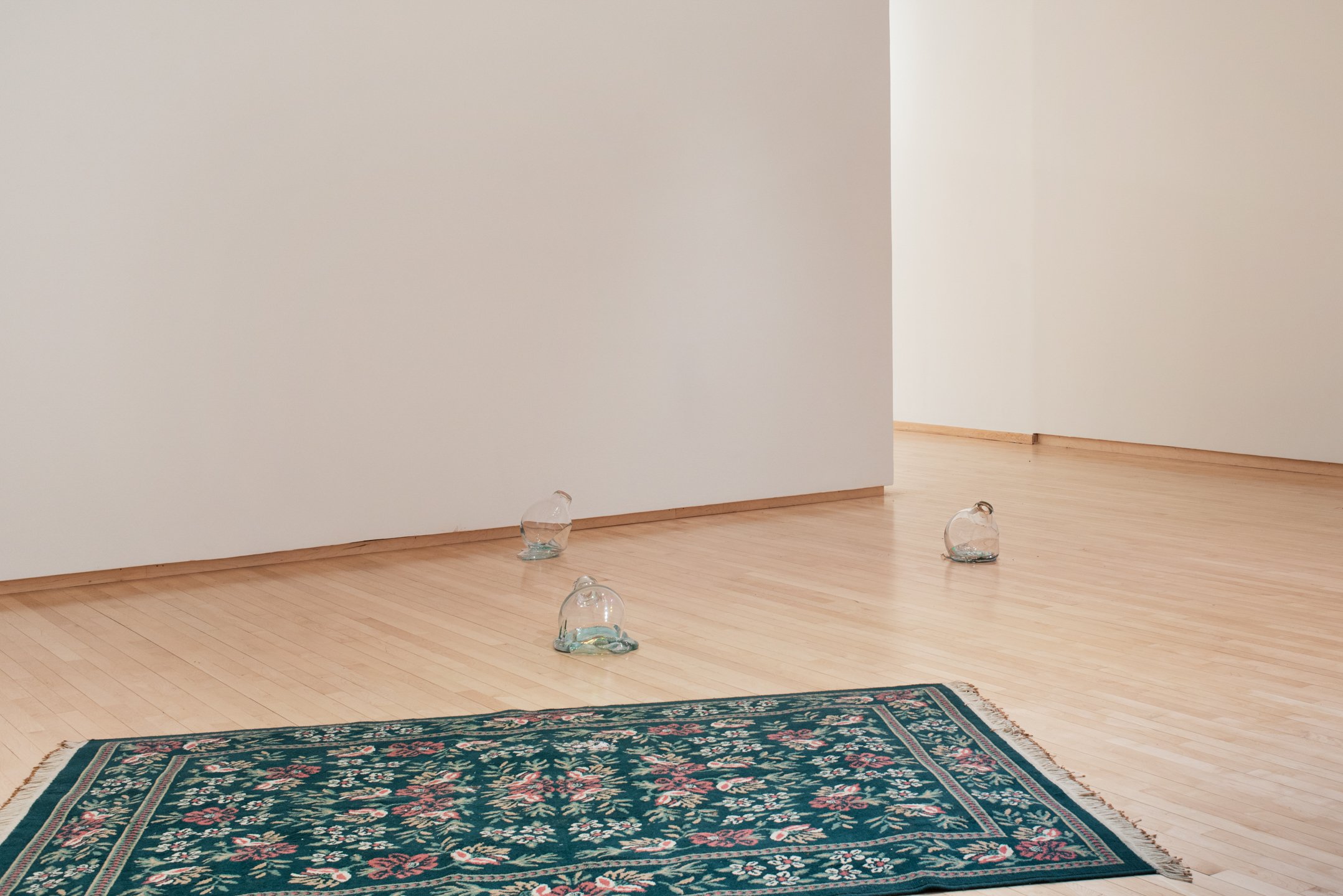 "Guarding Rug," Installation view, 2025, Found Rug, Glass, Wax, Gold Leaf, Hardboard, Plastic, and Glue. 94” by 59”
"Primordial Creation," Installation view, 2025, Glass and Vinyl. Size Variable, Photo Credit: Neighboring Sates
