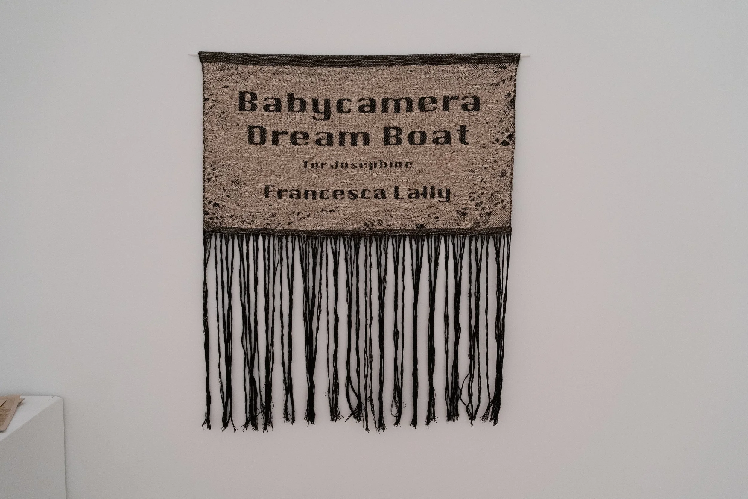 "Babycamera Dream Boat,"
2025,
Perforated cotton paper, waxed linen thread, overhead projectors.
4’ x 15’
Photo Credit: Brandon Aquino Straus