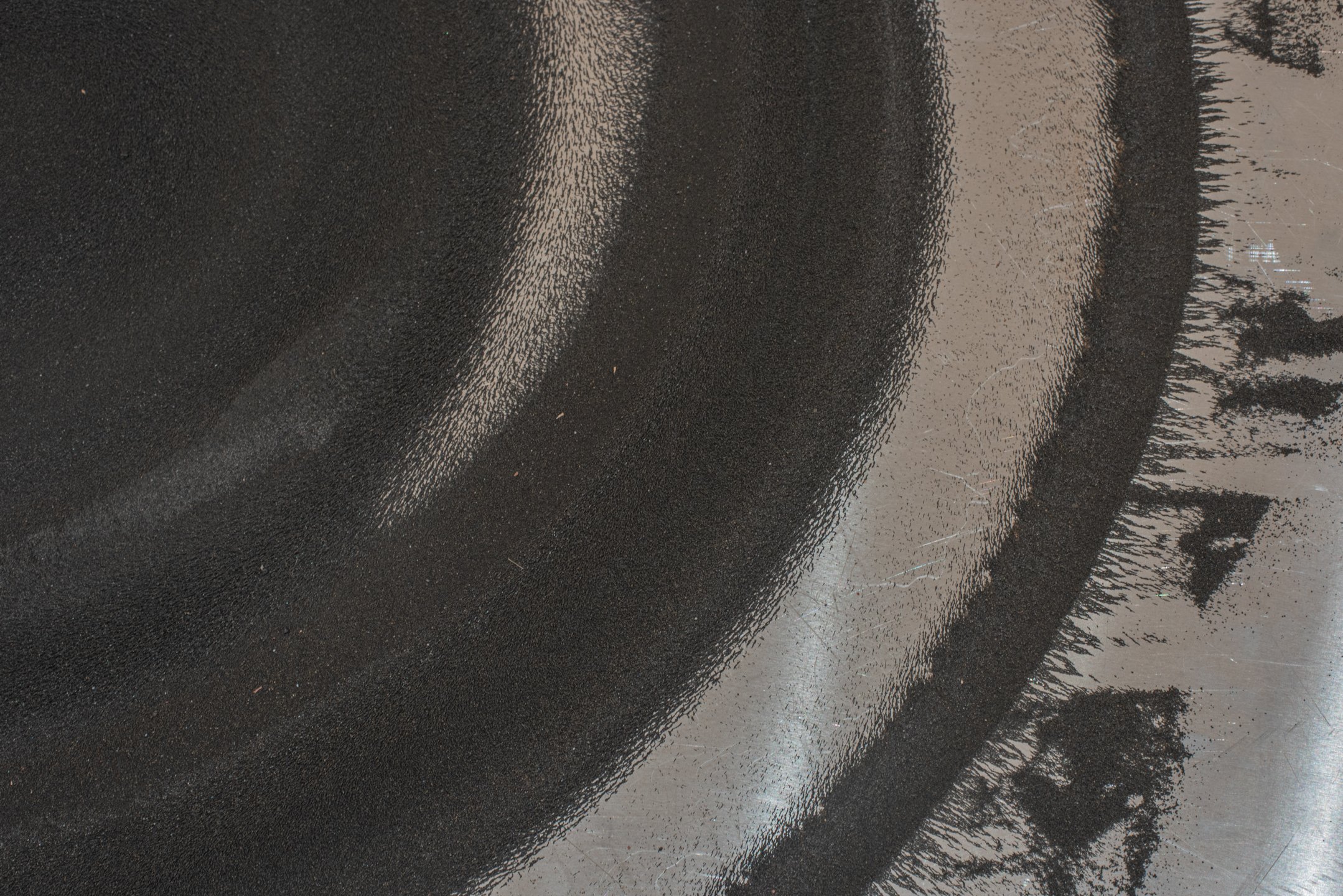 "Bristle when the shadow falls" (detail), 2025,
Steel dust, aluminum, steel, magnets, motor. Photo Credit: Neighboring States