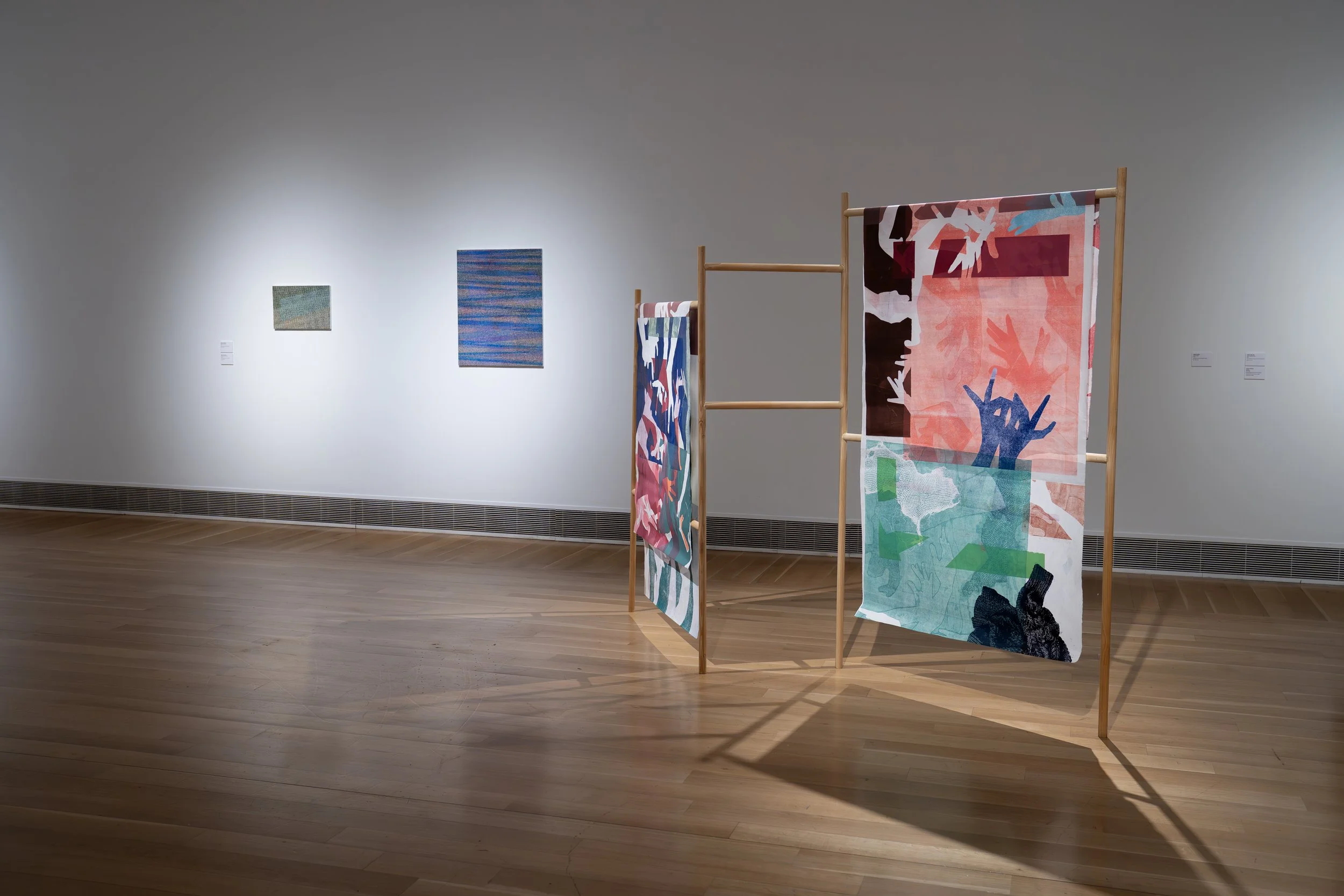 Olivia Smith, 
Frantic Hands, 
2026, 
Monoprint on mulberry paper, wood. 
62" x 110" x 12"
