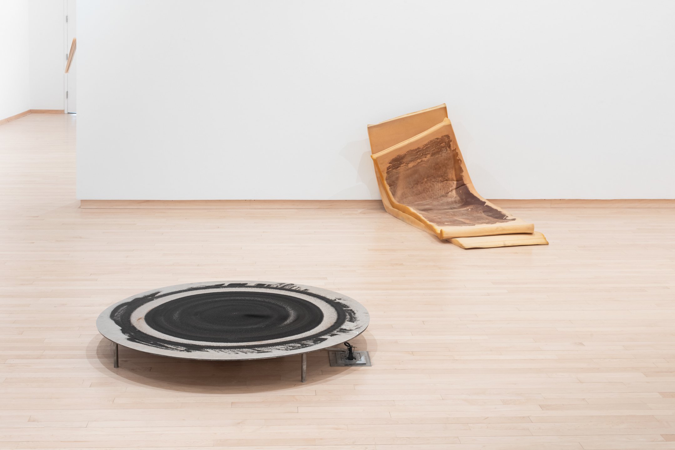 "Bristle when the shadow falls" 2025, Installation view. Steel dust, aluminum, steel,
magnets, motor (left).
"Light across the fold (for ma’or)" 2025 Image transfer on polyurethane foam (Right)
Photo credit: Neighboring States