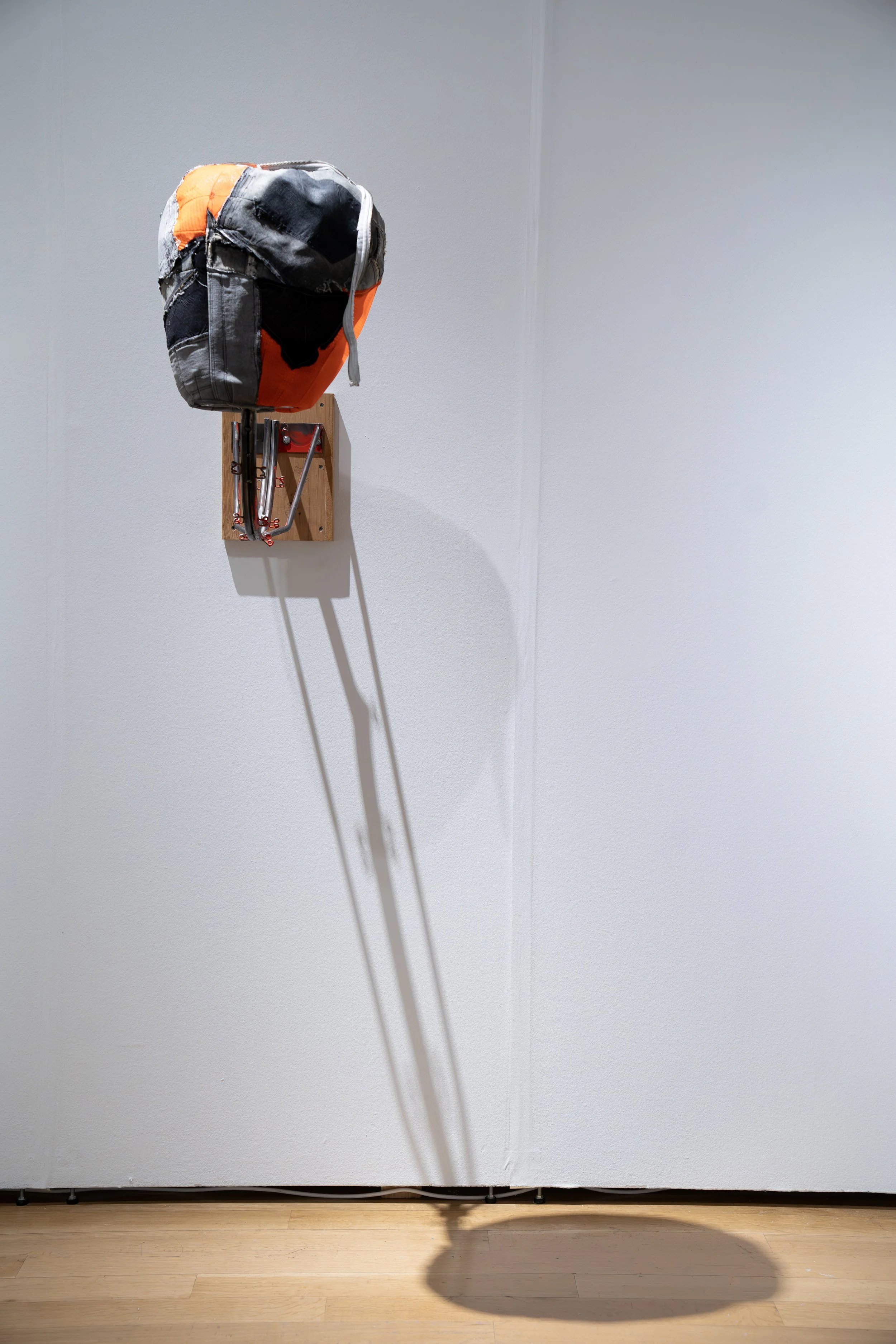 Rich Brown, 
MVP, 
2026, 
Repurposed basketball rim; repurposed sneakers, denim, basketball shorts. 
Dimensions variable 