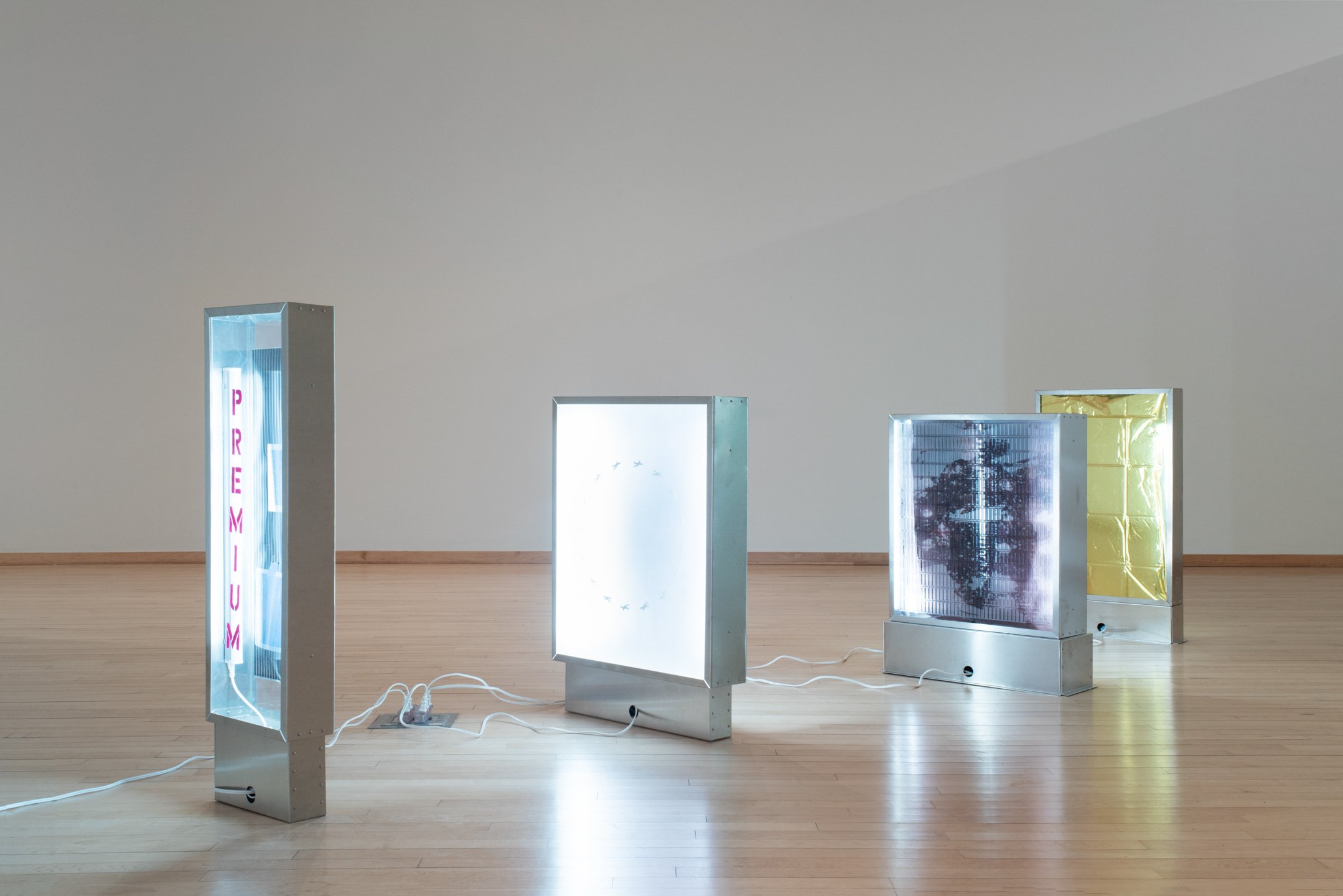 "Fatigue," Aluminum, plexiglass, LED tubes, machine screws, vinyl, extension cord, photographs on transparent film, mirrored privacy film, acrylic paint, tissue paper, metallic table cloth, inkjet, photograph, packing tape. Dimensions variable, 2025,