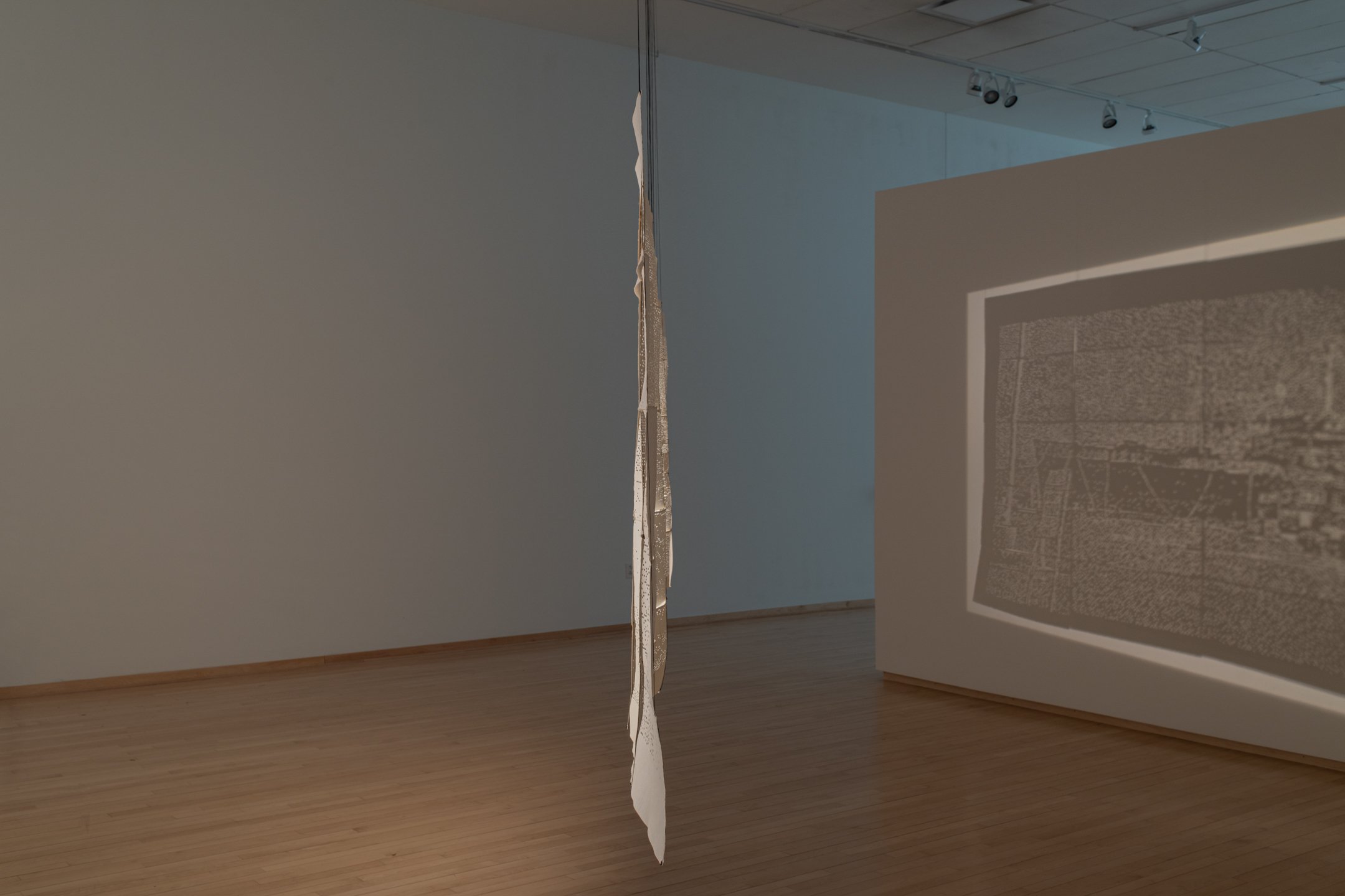 "Babycamera Dream Boat,"
2025,
Perforated cotton paper, waxed linen thread, overhead projectors.
4’ x 15’
Photo Credit: Neighboring States