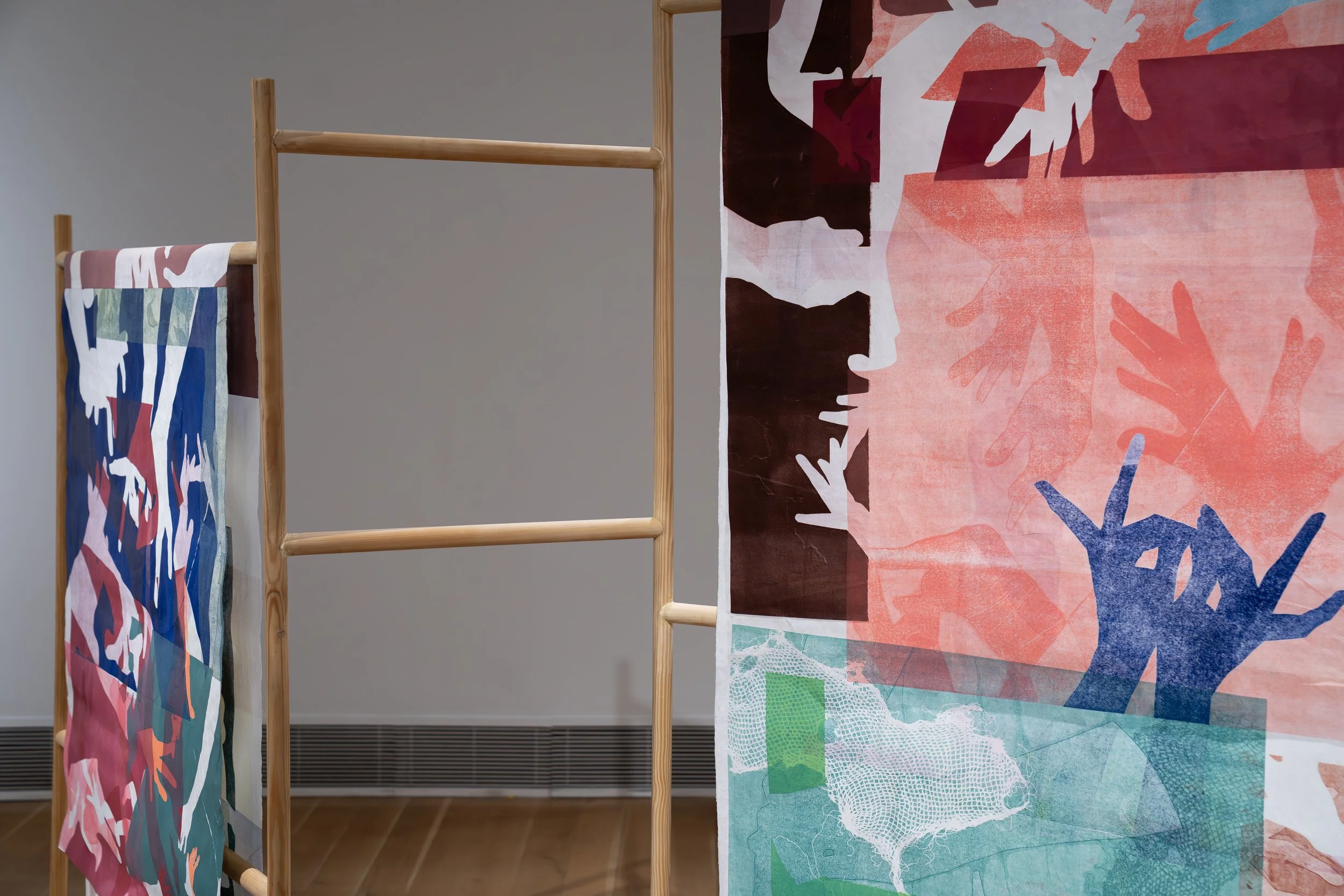 Olivia Smith, 
Frantic Hands, 
2026, 
Monoprint on mulberry paper, wood. 
62" x 110" x 12"