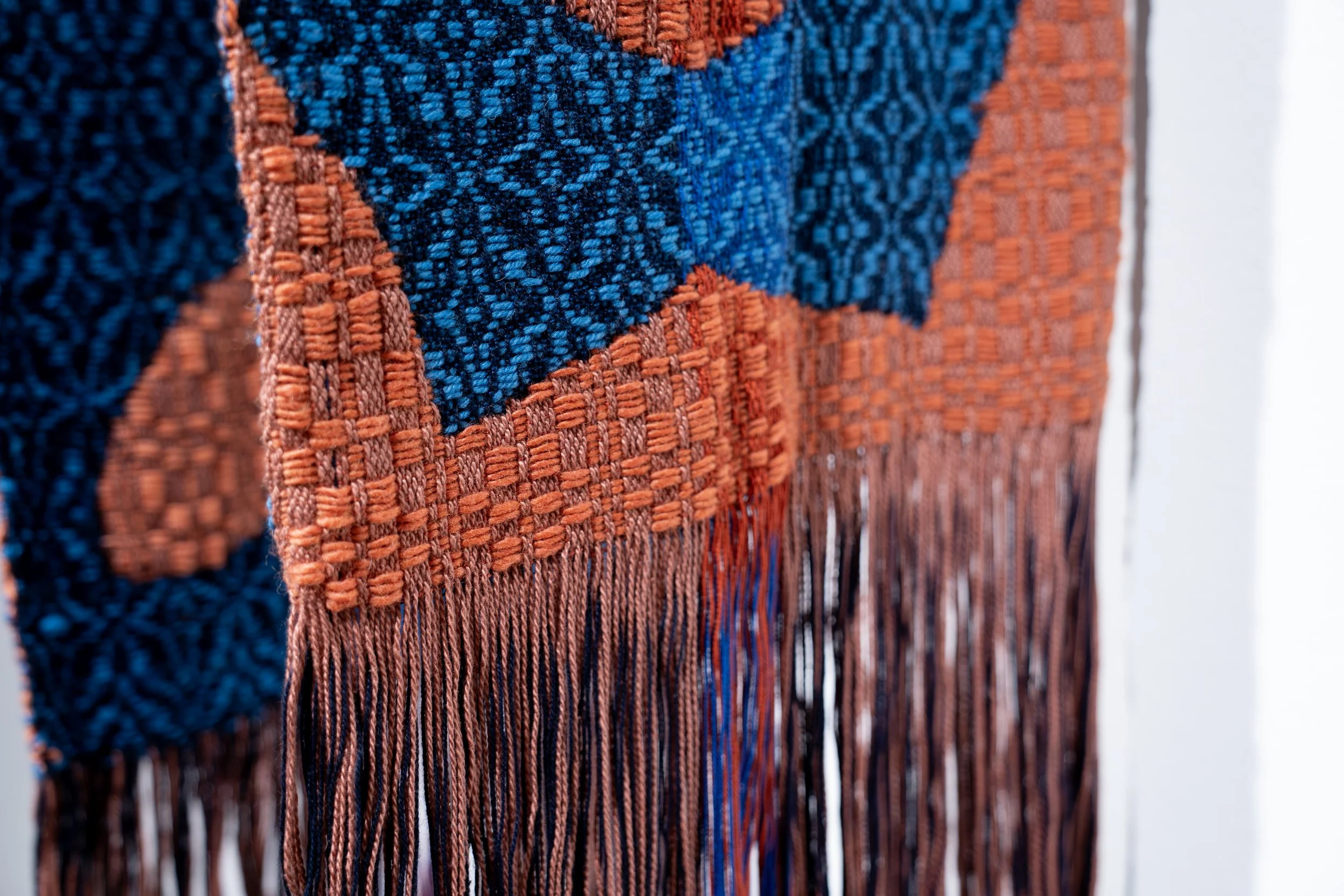 Olivia Smith,
Intertwined, 
2026, 
Cotton and wool weaving, wood. 
36" x 12" x 17" 