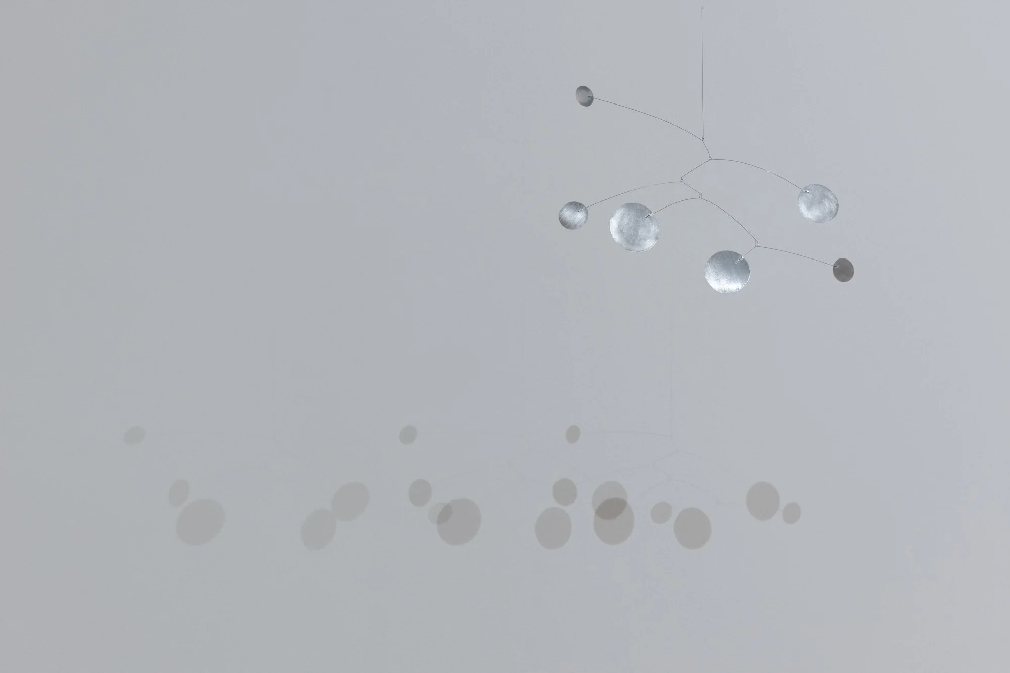 "Full Circle Mobile" (detail), Aluminum, steel wire. 16" x 9", Photo Credit: Sam Fritch