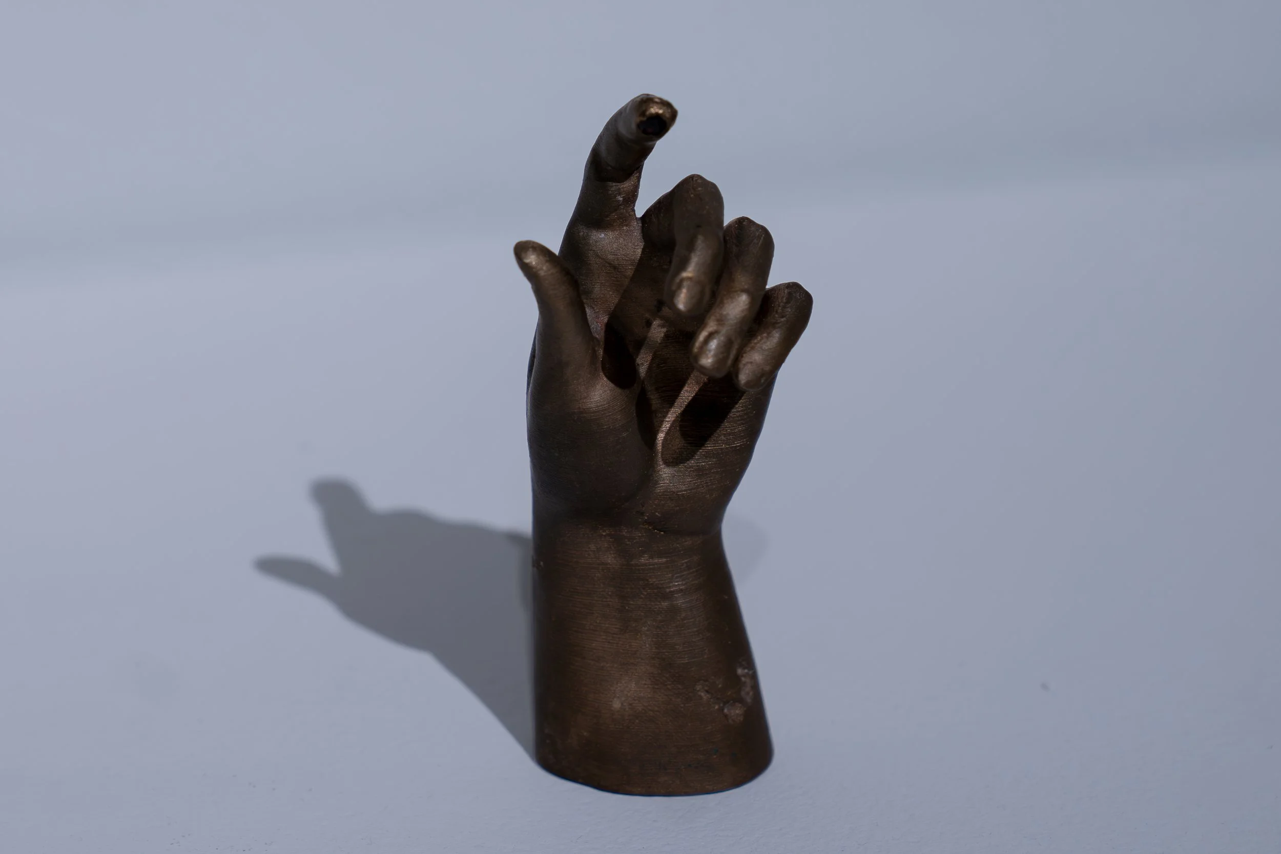 Daniel Gottschalk, 
The Hand Of, 
2026, 
Bronze, garnet. 
2 1/8" x 2 1/4" x 5 3/4" 