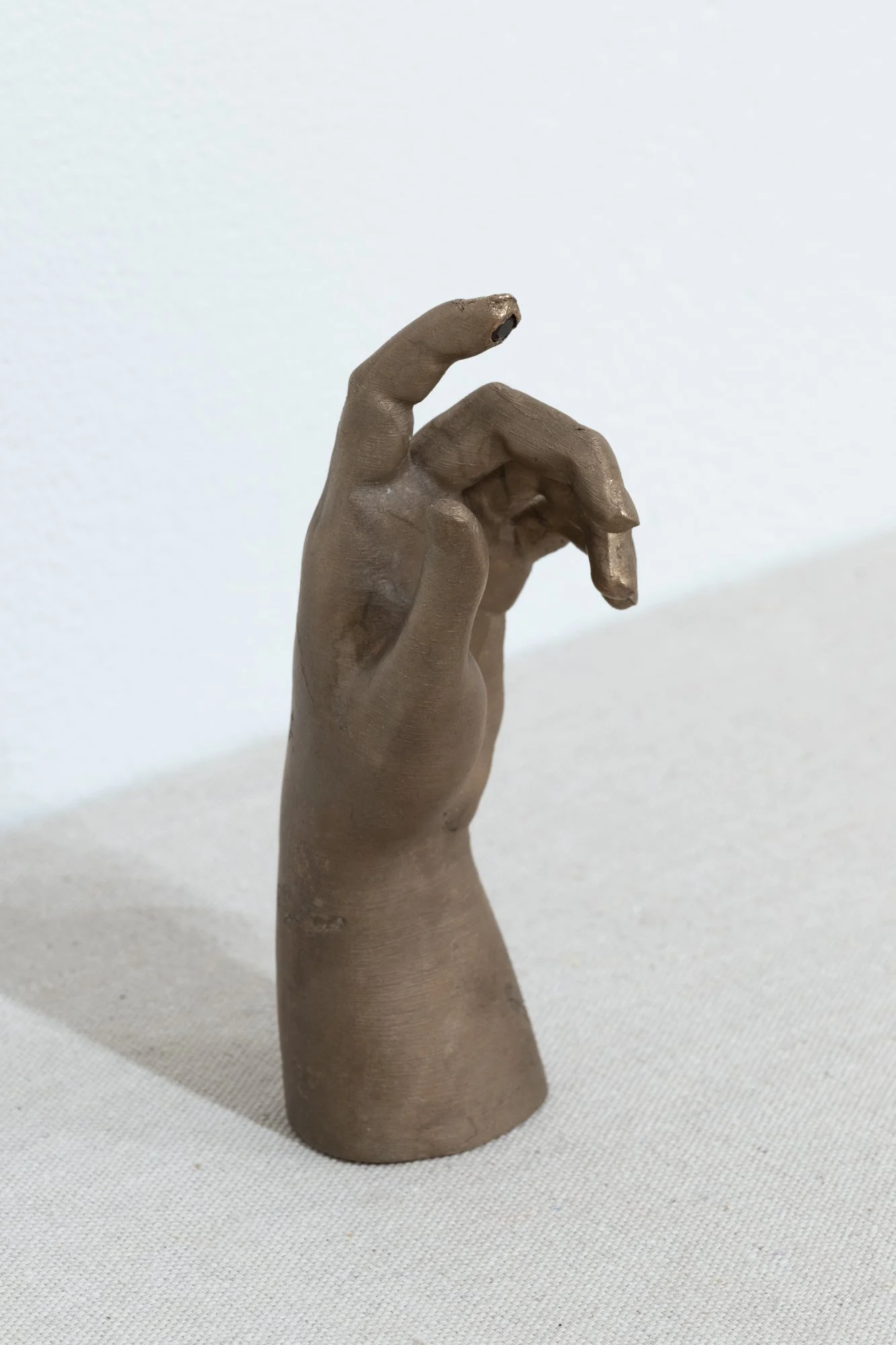 "The Hand of," 2 1/8" x 2 1/4" x 5 3/4", Bronze, Garnet, Photo Credit: Sam Fritch