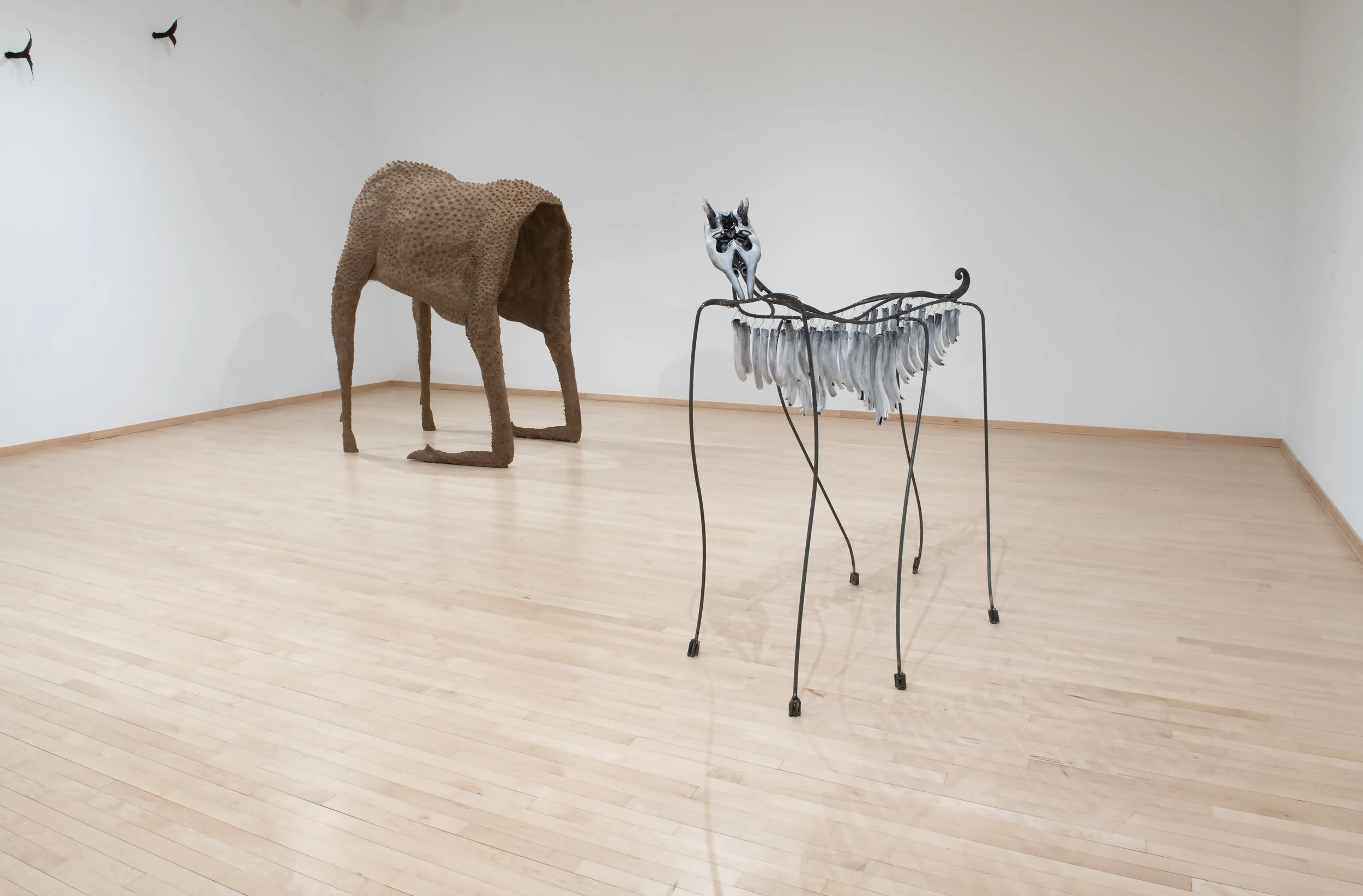 “Moose Husk” and “Chimes Horse”, Installation view,
Cardboard pulp, glue, chicken wire, wood, pvc, ceramic, underglaze, steel,
wool. Photo Credit: John Carlano