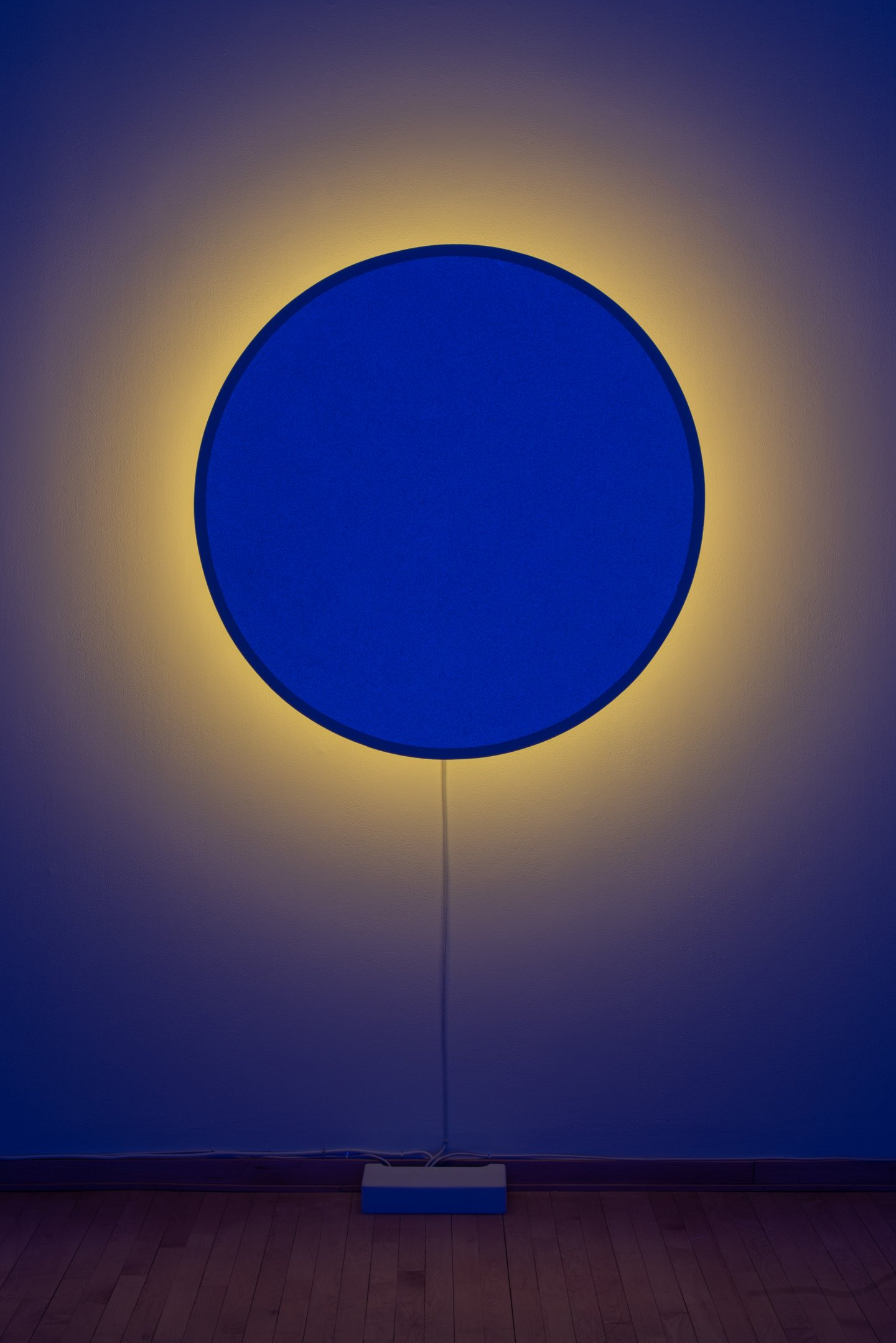 "In Totality" (still), 2025,
Time-based installation view showing “Optic Disc (Blue)”
Retroreflective glass microspheres, acrylic paint, foam, steel, LED light, computer controller. 46” by 46” by 14”
Photo credit: Neighboring States