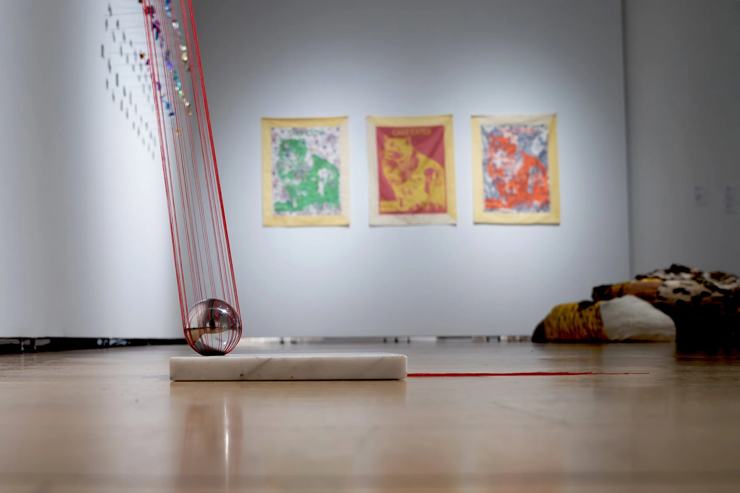 Mary Champagne,
Sunk cost, 
2025, 
Nylon, marble, steel. 
7" x 102" x 30"
