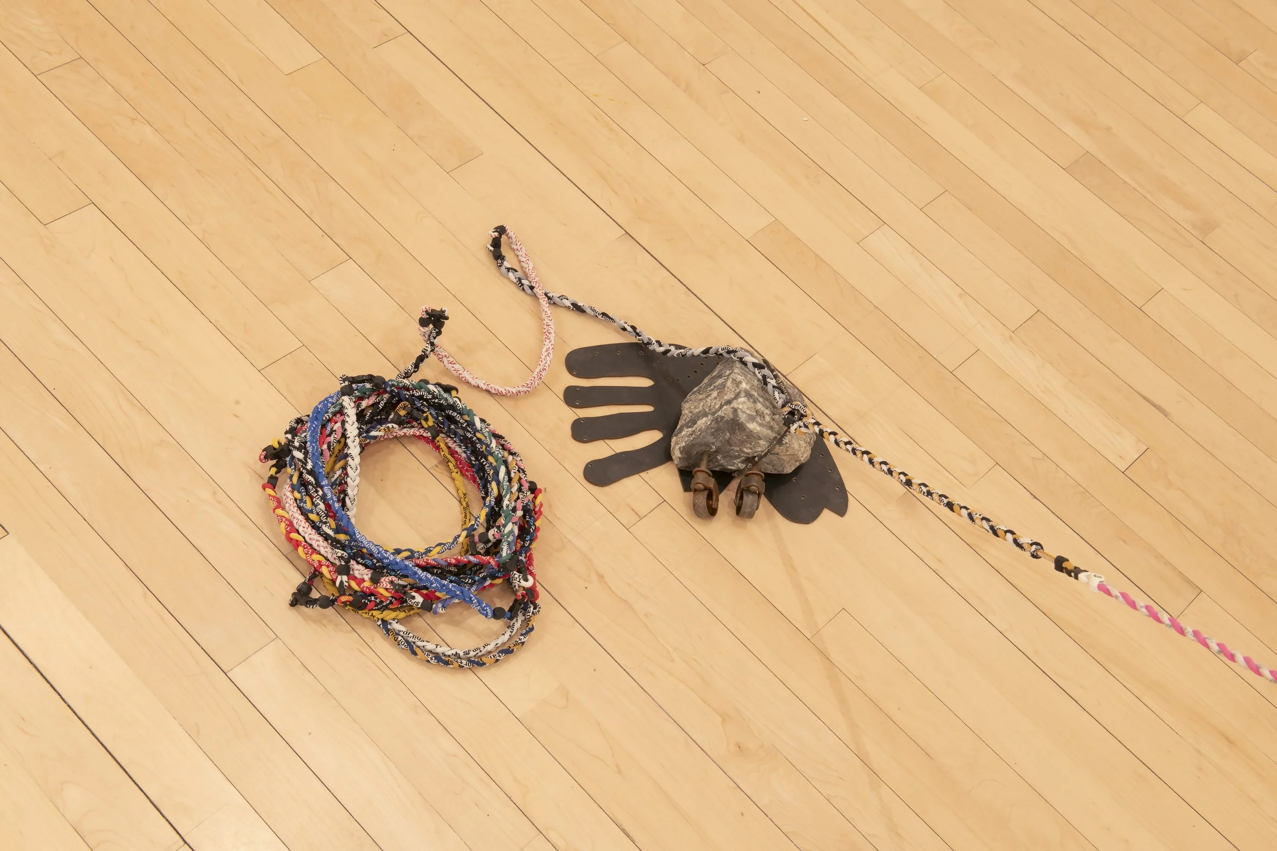 "That’s No Moon" (detail)
Steel, pine rosin, Death Star temporary tattoo, used titanium magnet braided 
necklaces, stone. Dimensions variable Photo Credit: John Carlano