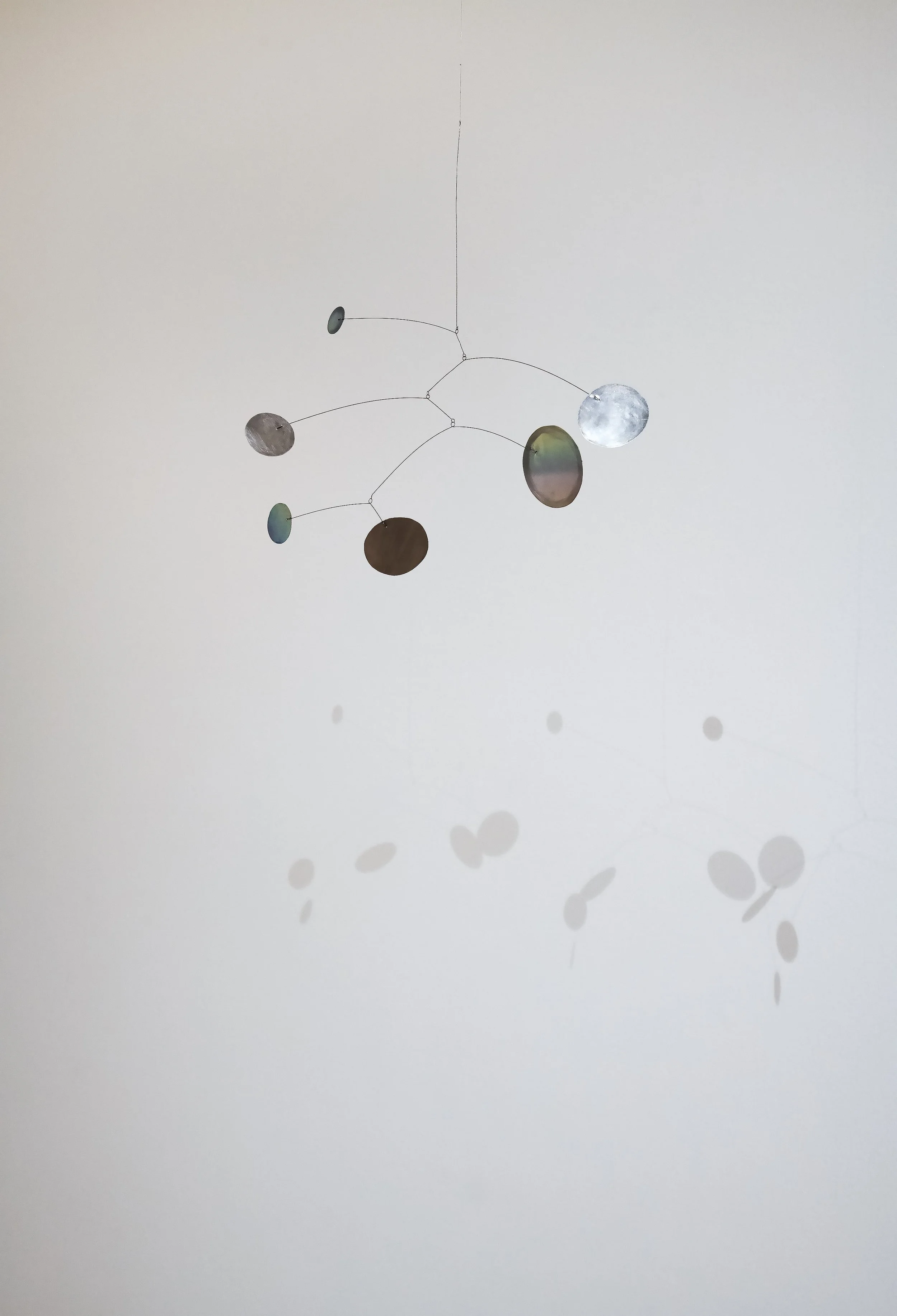 "Full Circle Mobile," (detail), Aluminum, steel wire. 16" x 9" Photo Credit: John Carlano