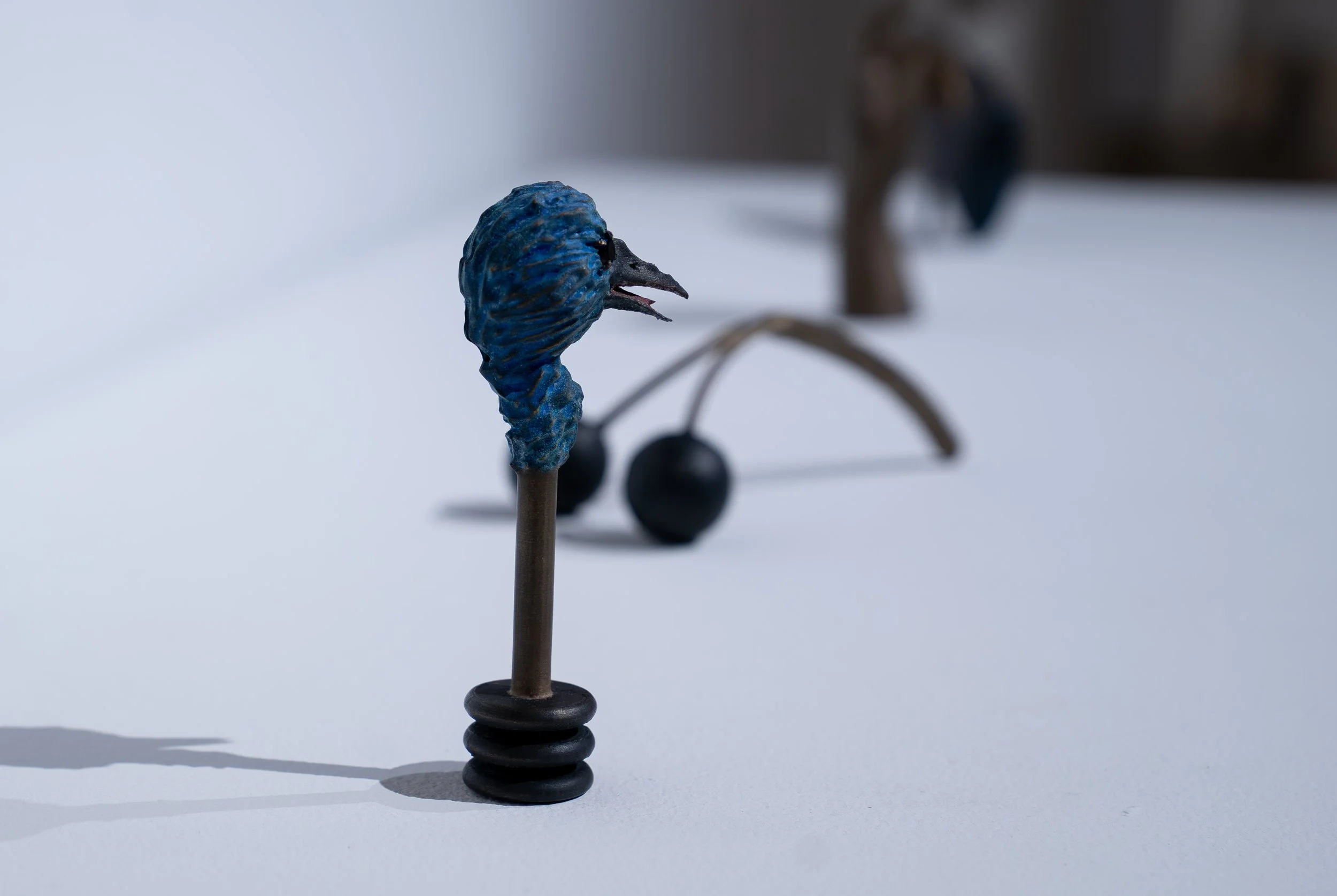 Daniel Gottschalk, 
Bick, 
2025, 
Bronze, sapphire. 
2 1/4" x 1 3/8" x 5 3/4" 