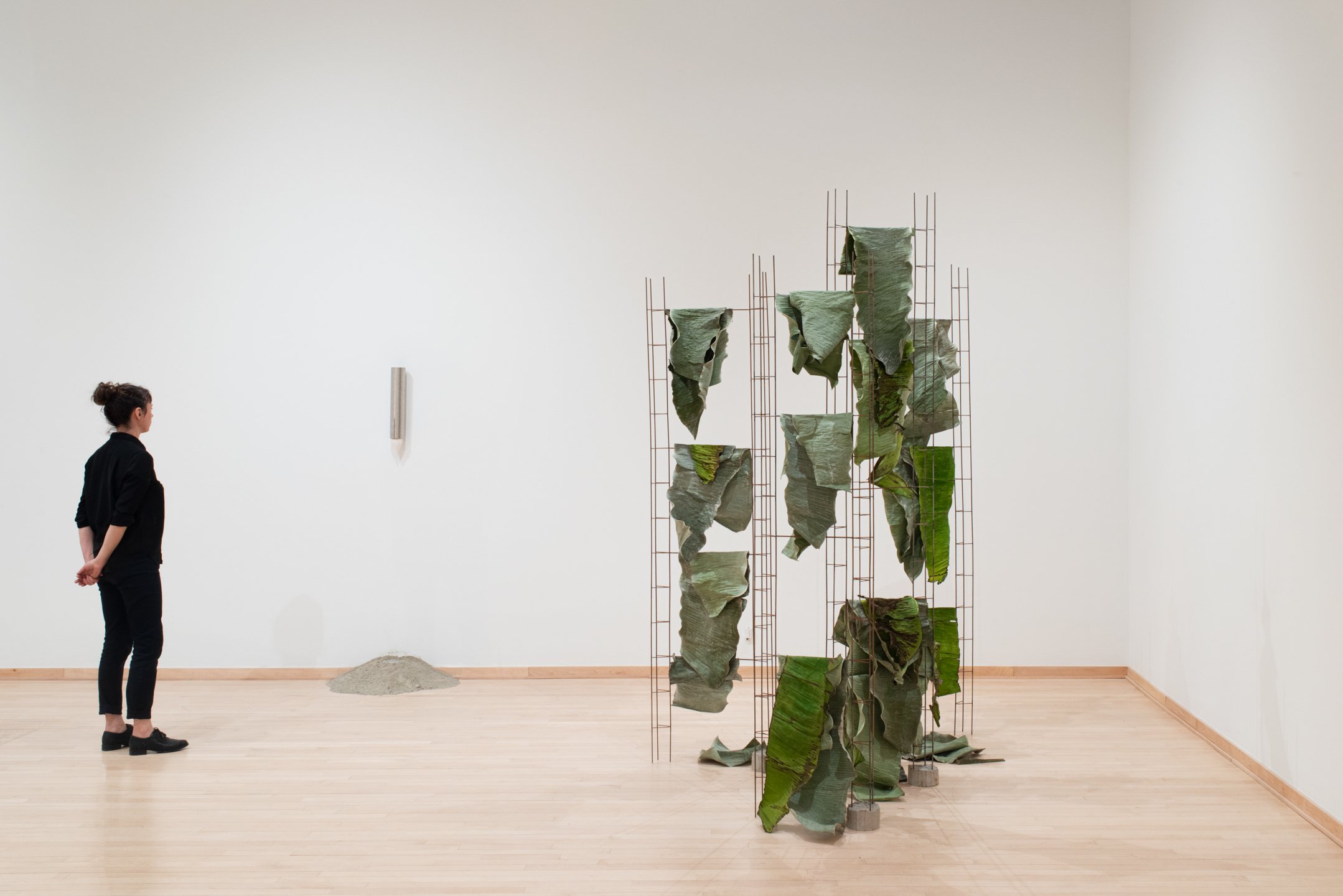 "not a single mouth" 2025, Installation view. Water cup dispenser, water, powder cement
(left).
"living is such wet data" 2025. Installation view Banana leaves, steel, cement (right)
Photo Credit: Neighboring States