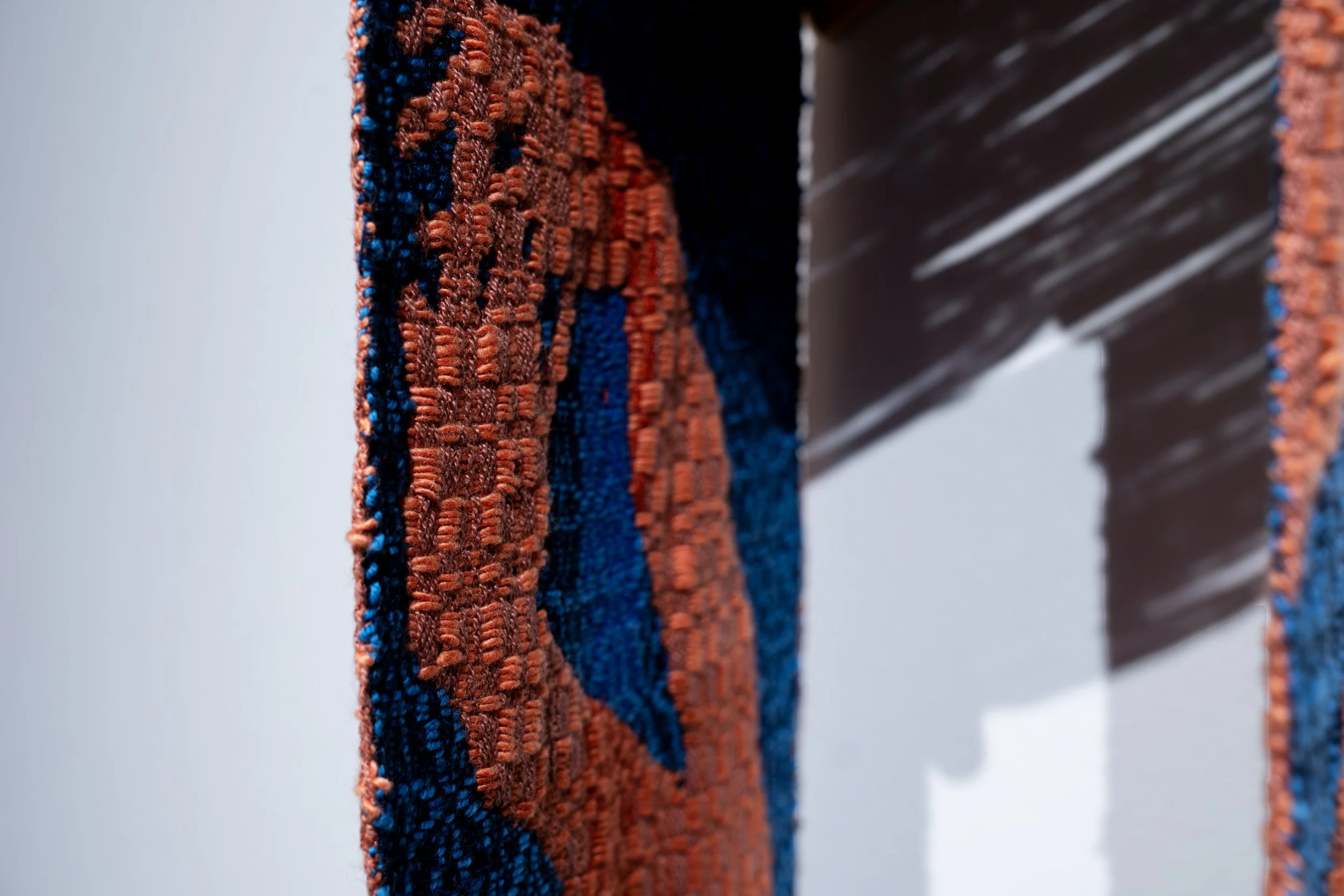 Olivia Smith,
Intertwined, 
2026, 
Cotton and wool weaving, wood. 
36" x 12" x 17" 