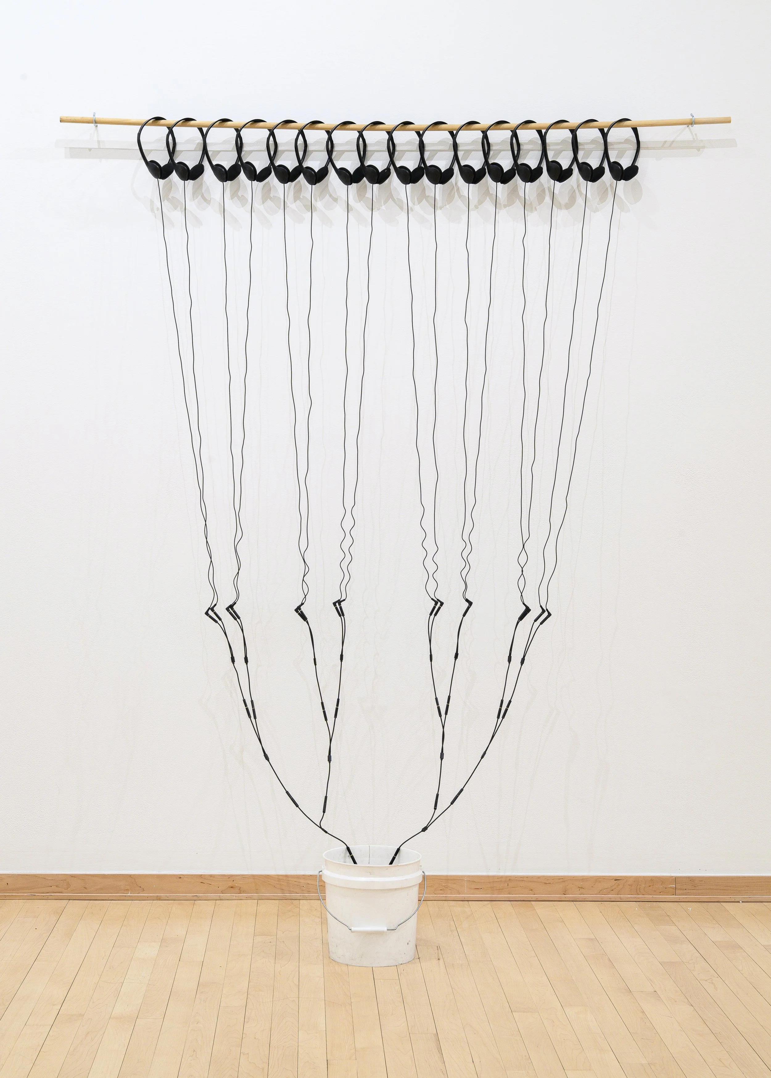 "Snow collected on the day the US and Israel bombed Iran"
Snowmelt, bucket, headphones, headphone splitters. 108" x 72" x 23".
Photo credit: Constance Mensh.