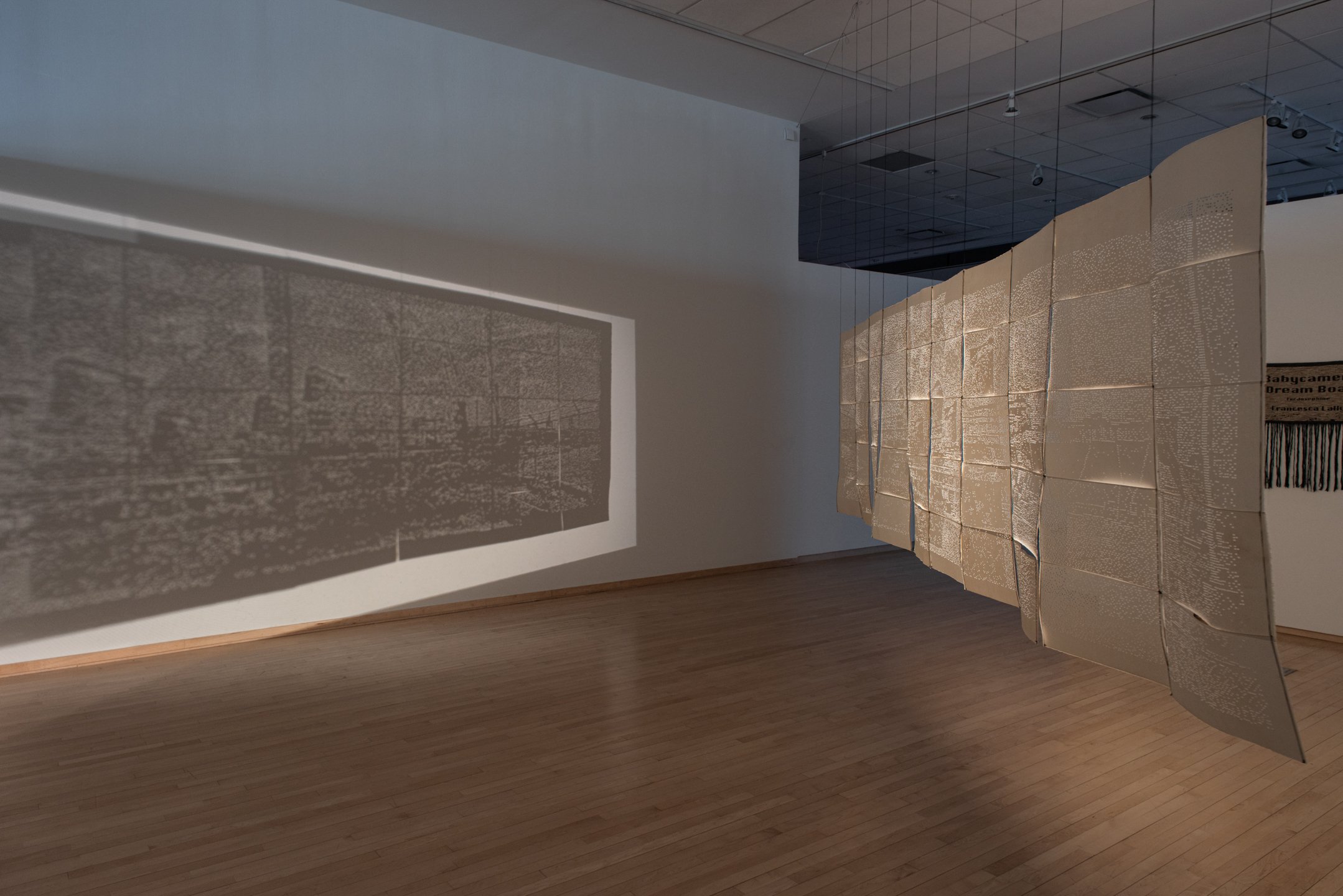 "Babycamera Dream Boat,"
2025,
Perforated cotton paper, waxed linen thread, overhead projectors.
4’ x 15’
Photo Credit: Neighboring States