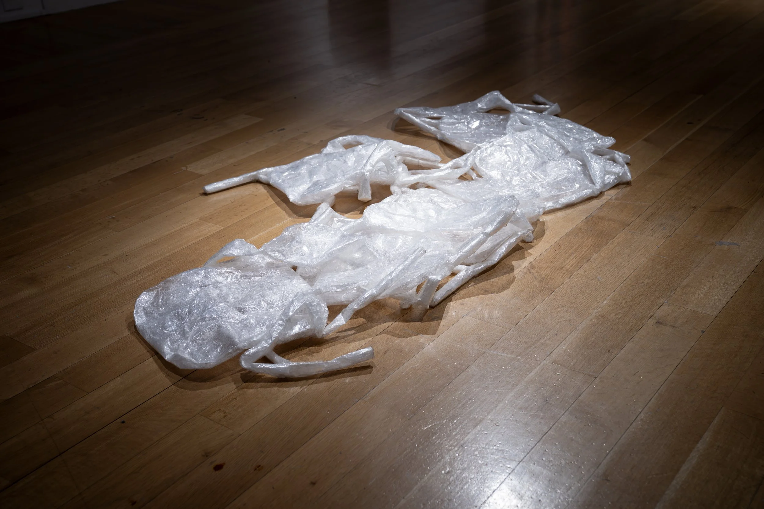 ev Leto, 
Untitled, tape chairs (front) ,
2024-2025, 
Packing tape. 
Dimensions variable 