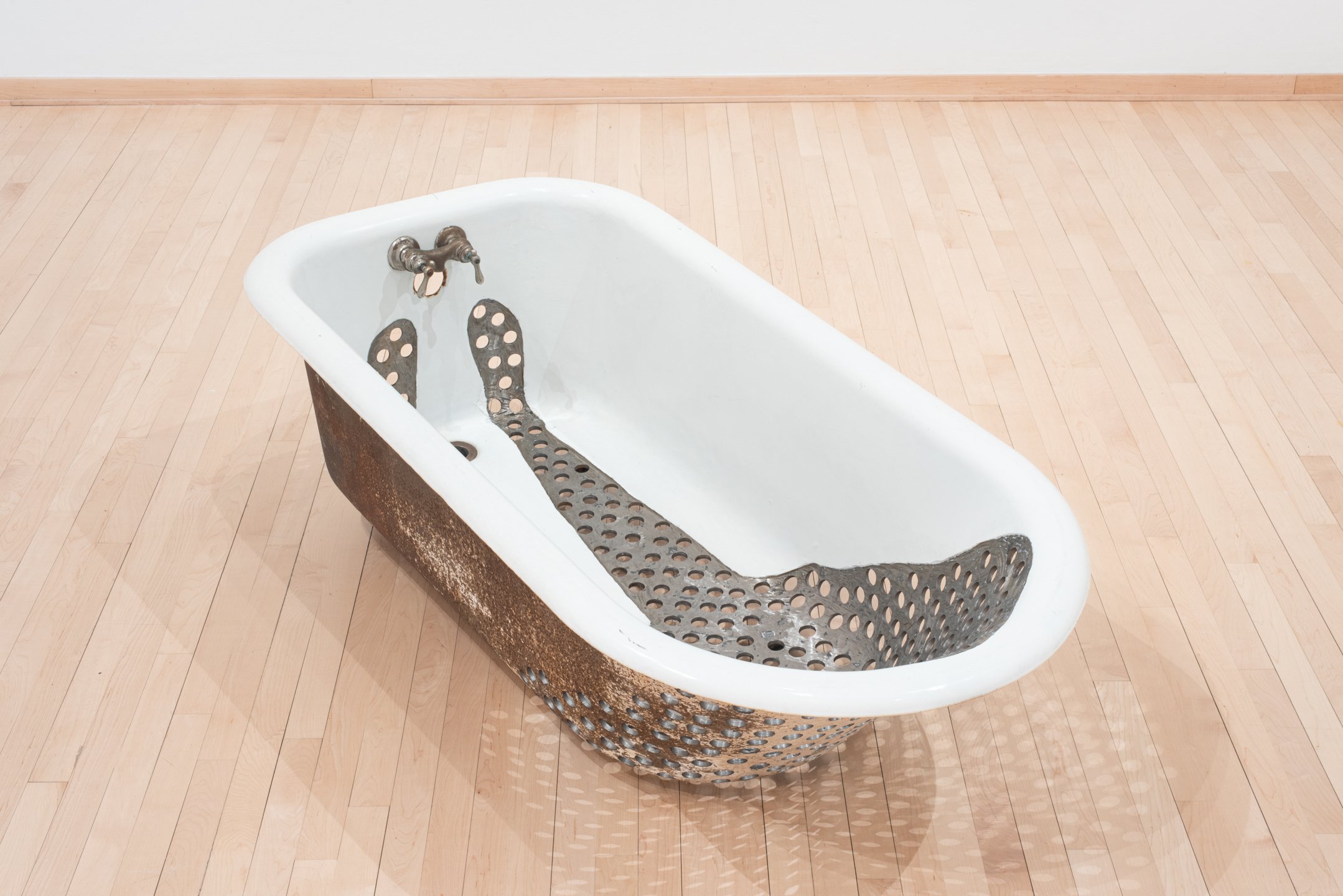 "Sunk" 2024, 59.5"x29.2"x19", cast iron tub. My body and all its holes.
