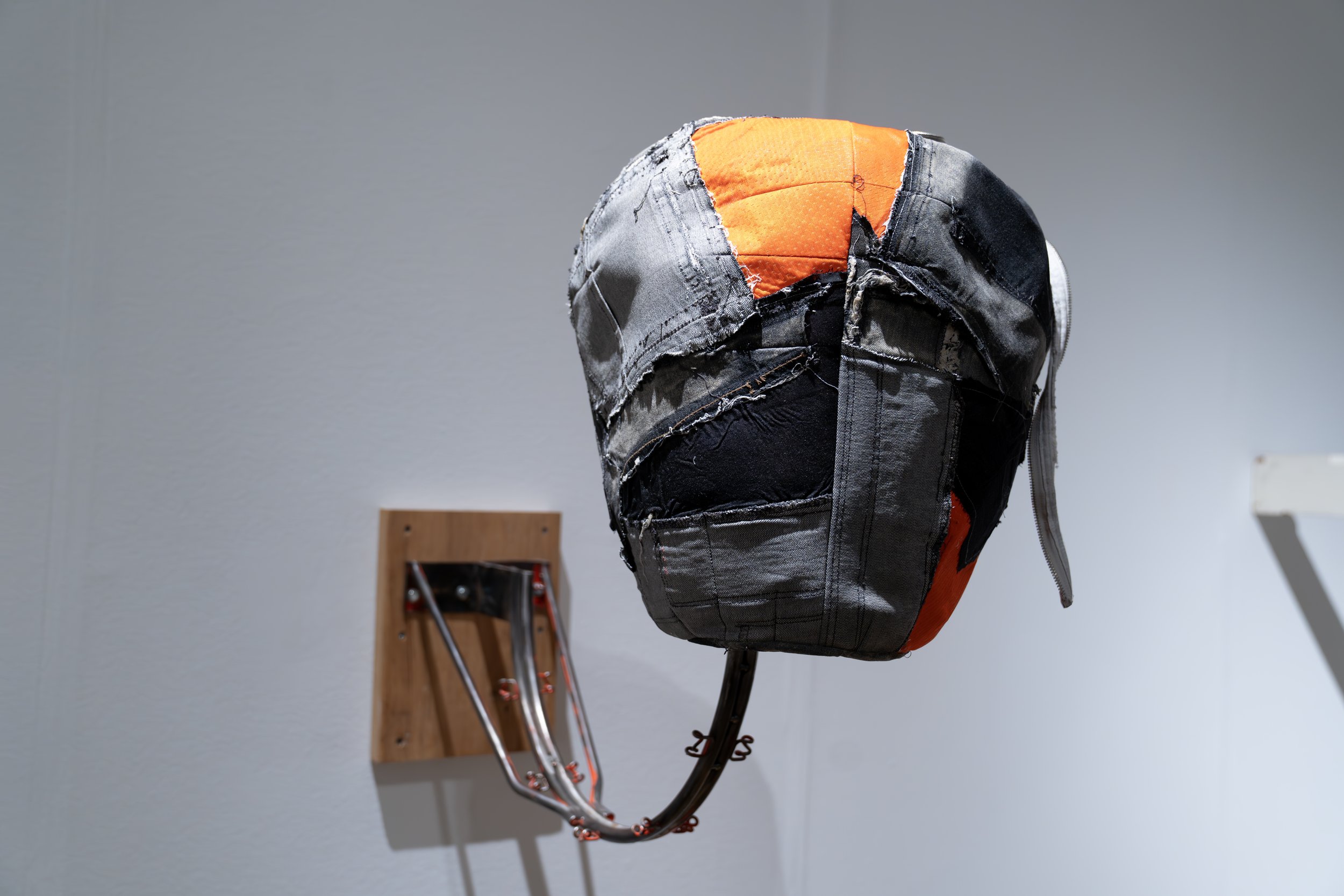 Rich Brown, 
MVP, 
2026, 
Repurposed basketball rim; repurposed sneakers, denim, basketball shorts. 
Dimensions variable 