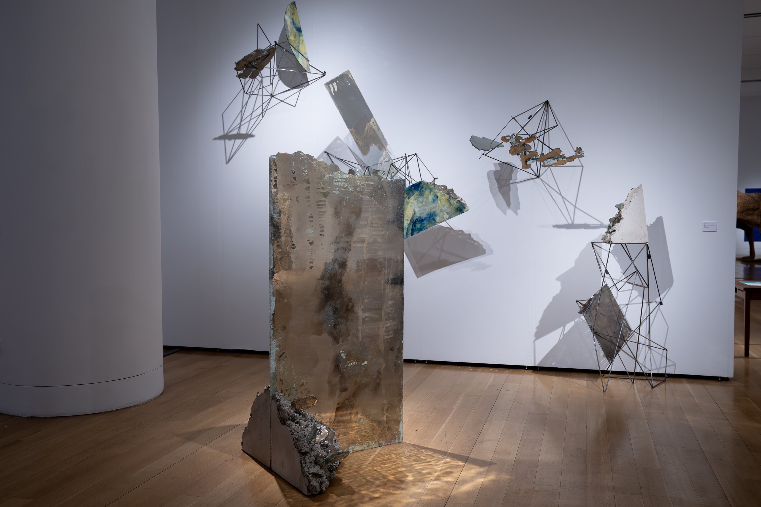 Laura Sallade, 
Mapping Occurrence, 
2026, 
Glass, silver, concrete, mixed-media paints,  
mylar, resin. 
Dimensions variable 