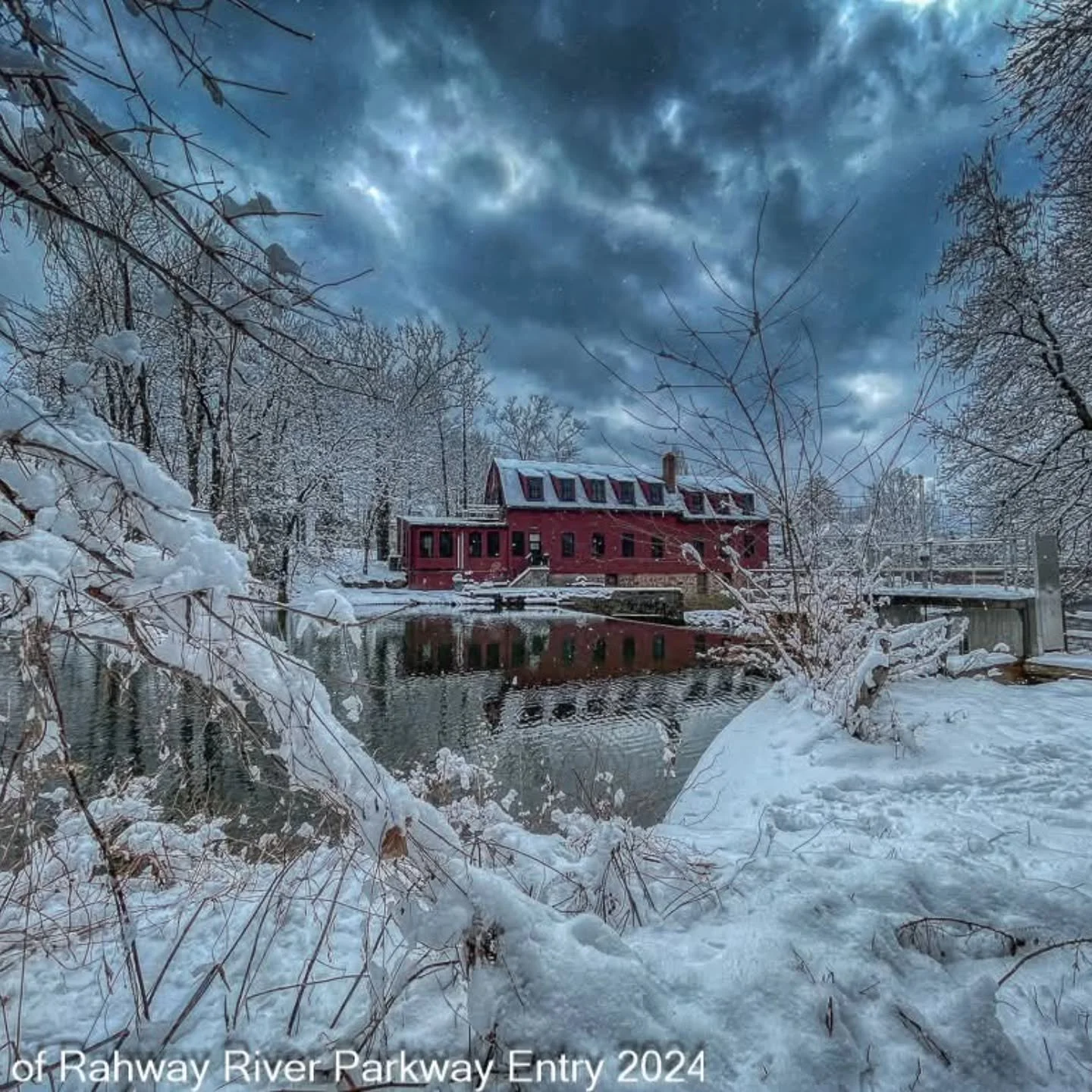 After a winter storm, Droescher&rsquo;s Mill in Cranford stands quietly along the Rahway River, framed by snow-capped trees and frost-covered grounds. The scene is a little icy, a little magical, and the river&rsquo;s crisp reflection captures the be