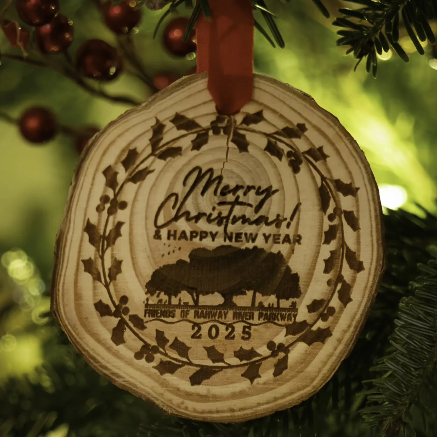 Our Limited Edition Rustic Pinewood Ornament is a festive addition to adorn our holiday season, celebrating the spirit of the Rahway River Parkway! Crafted with care and precision, this charming ornament features a holiday message from the Friends of