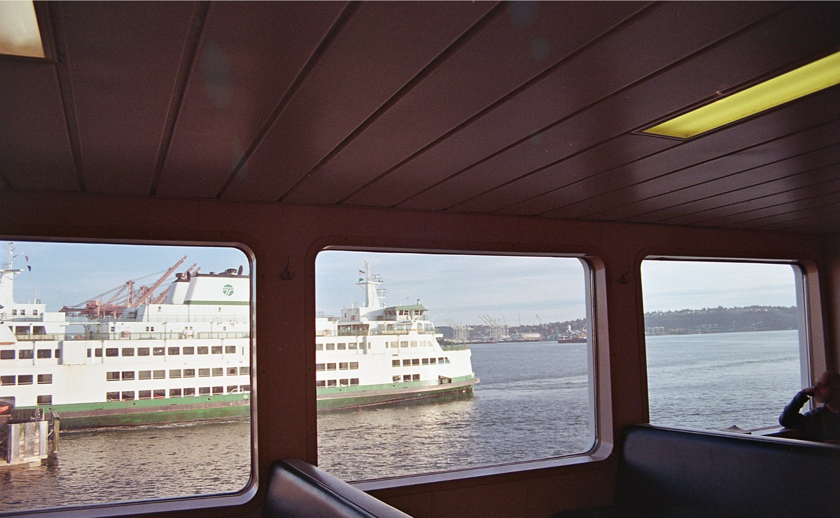 Picture out the window of Seattle-Bainbridge ferry, of another ferry pulling up to the dock. Taken on Fujifilm 200 using my Nikon F4004.