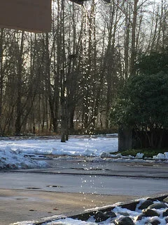 Newton Library sports waterfalls as snow melts off roof